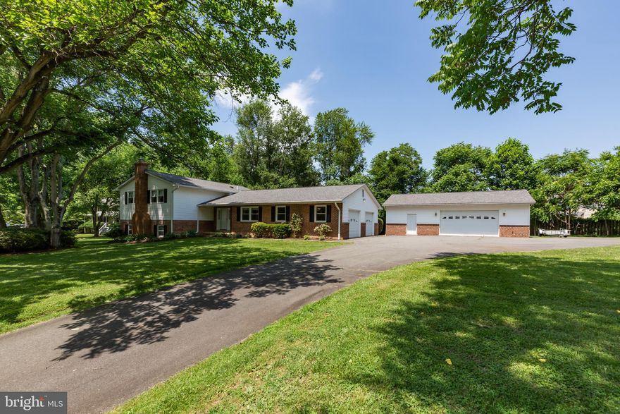 PRIME LOCATION! This home is located near EVERYTHING! Main level living made easy in this neat and clean home with no HOA on 1-acre. Well-maintained home with a 2-car attached and over-sized detached two car garage, with rough-in for full bath and utility sink. Top of the line HVAC system and 50 Year roof replaced two years ago. Detached garage has separate HVAC systems as well as cable TV. This home sits on a quiet street in Manassas. Enjoy close proximity to shopping: Harris Teeter, Starbucks, Buffalo Wild Wings, Krispy Kreme Donuts, Giant, Banks, and Parks. 2 miles to VRE Train.