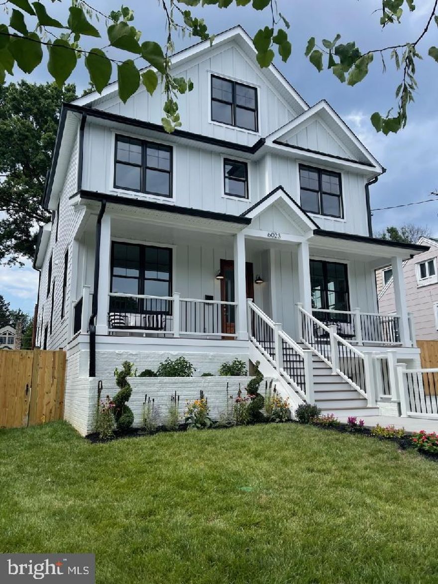 Modern Transitional New Construction in the popular Westover/Over Lee Knolls area.  Walk through the Mahogany front door and be greeted with 10' Ceilings, 7" Wide Plank Natural White Oak Flooring,  a Spacious Dining Room and a Home Office with Panel Molding Accent Wall.  3 Piece Crown Molding/Deep Floor Molding.  A Wide Hallway leads to the Open Concept Gourmet Kitchen.  Huge Center Island, Waterfall Edge Calacatta Luccia Quartz Counters, Breakfast Bar, Large Pendant Lights, Deep Under Mounted Sink, Rich Wood Cabinets Accent the Kitchen Island, GE Cafe Smart Stainless Steel Appliances including Range Hood, Six Burner Gas Stove, Wall Oven and Convection Microwave. White Double Stacked Cabinets, Soft Close Doors and Full Extension Drawers, White Tile with Undulated Surface on the Backsplash to the Ceiling, LED Under Cabinet Task Lighting, and Trash/Recycling Bin Cabinet. LED Recessed Lighting Throughout.  Butler's Pantry with Rich Wood Double Stacked Cabinets, Soft Close Doors and Drawers, Beverage Refrigerator, Open Shelving, Calacatta Luccia Quartz Counter, White Backsplash, Sink, and LED Under Cabinet Lighting.  Large Pantry with Built-in Shelving.  The Kitchen is Open to the Family Room and Breakfast Area.  The Deck Off of the Breakfast Area was constructed with Low Maintenance Composite Decking.  The Family Room has a Coffered Ceiling with Cove Crown Molding, Acupanel Feature Wall and Gas Fireplace with Large Format Porcelain Tile Surround.  The Powder Room on the Main Level has a Rich Wood Vanity with Marquina Midnight Quartz Counter.  Wide Staircase with Large Windows and Panel Molding Accent.  Custom Railing with Contemporary Metal Spindles and Oak Hand Rail.    9' Ceilings on the 2nd Level.  7" Wide Plank White Oak Flooring on the Upper 2 Levels.  The Primary Suite has 2 Walk-in Closets, Acupanel Feature Wall, 2 Piece Crown Molding, and Deep Floor Molding.  Ceiling Fan Pre-wire in each Bedroom.  The Primary Bathroom has a Huge Glass Enclosed Walk-in Shower with Bench and Rain Shower, 30" X 60" Porcelain Tile Floor, Tub and Shower Surround with Storage Niches, Separate Soaking Tub, Separate Light Gray Maple Vanities with Calacatta Luccia Quartz Counters, and Water Closet. 1 of the 3 additional bedrooms on the same level has an Ensuite Bathroom with Glass Enclosed Walk-in Shower.  The Hall Bathroom has a  Combination Tub/Shower, Dual Sink White Vanity with Marquina Midnight Quartz Counter, and Modern Hexagon Porcelain Tile Floor.  The Laundry Room on The 2nd Level includes White Cabinets and Folding Area with Calacatta Luccia Quartz Counter, Laundry Sink, Linen Closet and Porcelain Tile Floor.  The Top Level boasts a Loft Space with Electric Fireplace and Built-in Shelves, Full Bathroom with Glass Enclosed Walk-in Shower, and a Large Bedroom with Oversized Closet.   7" LVP Flooring on the Lower Level.  A Huge Recreation Room with a Wet Bar with Marquina Midnight Quartz Counter, Rich Wood Cabinets, Open Shelving, and 2nd Beverage Refrigerator.  Bedroom 6 is on the Lower Level and a Full Bathroom with Walk-in Shower is in the Hall.  Under Stairs Storage Closet. Kohler Plumbing Fixtures throughout. CAT6 on all four levels. A Mud Room with Built-in Storage is beside the Garage.  Glass Panel Door to the Backyard on the Lower Level. Walk Out to New Sod in the Flat Back yard with a New Fence.  A Welcoming Front Porch was constructed with Maintenance Free Composite Decking (Pre-wired for Ceiling Fans).  Keypad entry on the Front Door and Garage.  Flagstone Lead Walk Entrance.  Large Storage Room.  New Landscaping.  Hardiplank Siding.   30 Year Architectural Roof Shingles.  Metal Roof on the porch. Gutter Guards and Flood Lights. 1 Car Garage with Keypad Entry and Concrete 3 Car Driveway.  Conveniently Located!  Just a few blocks to Westover's Dining, Retail, Library, Newly Constructed Cardinal Elementary or Swanson Middle School.  Under 1 Mile to East Falls Church Metro.  The sellers prefer Monarch Title.
