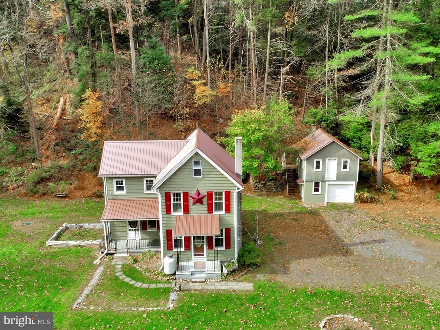 Welcome home to this adorable two story home in a country setting! There are two bedrooms, two full baths and it has been tastefully updated! There are replacement windows throughout,newer roof 2017, stone tile kitchen floor, ceramic tile floors, bathroom has marble counter tops, oil heat, freestanding propane fireplace, one car detached garage with second story which would be perfect for a workshop or for extra storage.