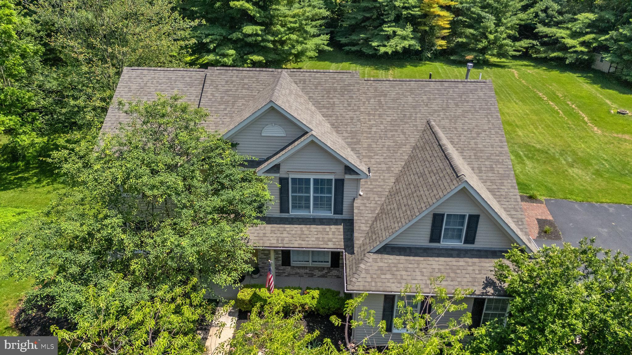 This impressive Colonial is situated in beautiful East Nantmeal Township where 50% of all grounds are protected and dedicated open space to conserve the natural landscape. The location could not be better and is also situated between French Creek State Park and Marsh Creek State Park, a 1,705 acre park with walking, biking, hiking trails, fishing, boating, swimming and more. It's also only a few short miles from shopping and entertainment. There is a lot to admire in this 4 bedroom, 3.5 bath home, including the kitchen addition that would impress any chef. Enter into the 2-story foyer with marble flooring that enters into the family room is polished with hardwood floors and gas fireplace with vaulted ceiling. Natural light-filled views from every window. The main level provides comfort and convenience featuring a formal living room, the formal dining room has trayed ceiling, hardwood floors, chair rail and crown molding. Off the family room is the main level study with glass door entry provides a quiet area for work, featuring hardwood floors, chair rail and crown molding. Off to the right, enter into the gorgeous kitchen, featuring Brazilian granite "crocodile leather" counter tops; the center island has a furniture-like feel, fully equipped with electricity and tons of storage, built in spring shelf for a large mixer. Designed for functional use, this kitchen features 2 dishwashers, double wall over and cooktop, with custom hood, and a separate pantry. French doors lead to a covered porch/deck with composite decking. There is a pedestrian door from the driveway that has ceramic tile flooring leading to the mudroom/laundry room with set tub. Located feet from the mudroom is the powder room. Upstairs you will love the Master bedroom with a recently remodeled private Master bath with double bowl vanity, soaking tub, 3'X3' stall shower with glass door, and a walk-in closet. The three additional bedrooms have convenient access to the updated and modern hall bath. The upgraded hall bath features ceramic tile, subway tile bath, and lighted mirror. In the lower level, you will find additional living space including a full bath with stall shower, finished for a man cave, playroom, and exercise room, with plenty of additional storage. The privacy woods surrounding the property located in a cul-de-sac, 2.2 acre level lot is just waiting for a pool. Oversized shed in read to store all your tools, lawn equipment, or turn into a workshop. Neighborhood is quiet, great for all the dog walkers, kid-biking, great place to raise a family. All of this and in Owen J Roberts School District and awarded Blue Ribbon West Vincent Elementary School. This property will offer nothing but years of pure enjoyment. Just minutes from Marsh Creek State Park, Struble Trail, Eagleview's Restaurant Row, and Routes 100/113/30 & the PA Turnpike—this is your opportunity to own a peaceful, storybook retreat with modern updates and room to grow. Co-owner is a Licensed PA real estate.