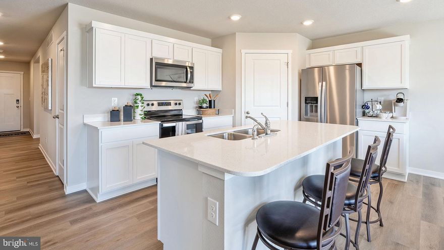 Come see the Hamilton floorplan. This single-story home option is beautifully laid out with 3 bedrooms, 2 bathrooms, with a large unfinished basement, and a 2-car garage with 1,498 finished square feet. 

When you enter the home, you'll be greeted with two bedrooms and a secondary bathroom, as well as a main level laundry room. Continuing down the hallway, find yourself in the open concept living area that blends the kitchen, great room, and dining area. The kitchen features shaker-style cabinetry and quartz countertops. It is set off from the living area by a kitchen island with a built-in sink. Walking through the great room, you'll find the primary bedroom with an attached bathroom. The bathroom has a double vanity and a large walk-in closet for all your belongings.