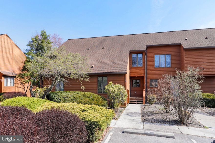 Beautifully maintained Villa with stunning views of the 17th Fairway of the Stony Lick Mid-length Golf Course. Home is within walking distance to the Pro Shop, Driving range, Clubhouse Grille, practice putting/sand trap area and outdoor pool. Enjoy spending time on the open deck off of the living room and the primary bedroom with views of the golf course. Cozy up in front of the wood burning fireplace in the living room on those chilling days. The main level bedroom connects to the full bathroom which could be used as a den or TV room. Upgraded Kraftmaid Maple kitchen cabinets with Corian counter tops and Stainless Steel appliances. Upper level consists of the primary bedroom with vaulted ceilings, sliding glass door to the open deck, 2 large closets, full bath with a separate shower/glass doors, 2 separate vanities and large counter top with wrap around mirrors and skylight for lots of natural light. The 2nd upstairs bedroom is also en suite, and has a large walk-in attic/closet big enough to be a craft room. Separate laundry closet located upstairs with side by side washer and dryer. Selling furnished-turn key(see list).