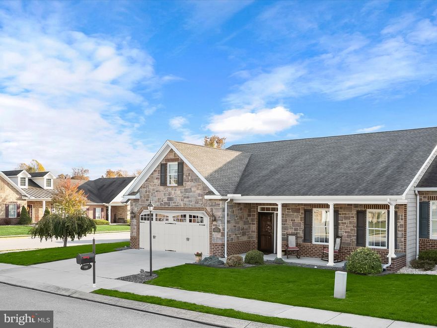 Welcome to this charming rancher in the heart of the Littlestown community of Adams County! This beautifully maintained home features a classic brick and stone exterior with landscaped grounds and a welcoming front patio. Step inside to find hardwood floors that flow through the main living areas, where the gas-burning fireplace with dentil accent molding serves as the perfect focal point. The open-concept design leads seamlessly into the kitchen, complete with 42” cabinetry, a decorative backsplash, display and wine storage, ample counter space, and stainless steel appliances. The dining area opens to a screened-in patio overlooking the fenced backyard and additional patio, ideal for relaxing or grilling. The primary bedroom suite offers plush carpet, high ceilings, custom blinds, and an en-suite bath with a double vanity and convenient access to the walk-in closet and laundry area. Two additional bedrooms and a full hall bath complete the layout. Additional highlights include an attached two-car garage and proximity to major commuter routes such as PA-194, US-15, and Baltimore Pike. Perfect for those seeking single-level living with modern comfort and timeless charm!