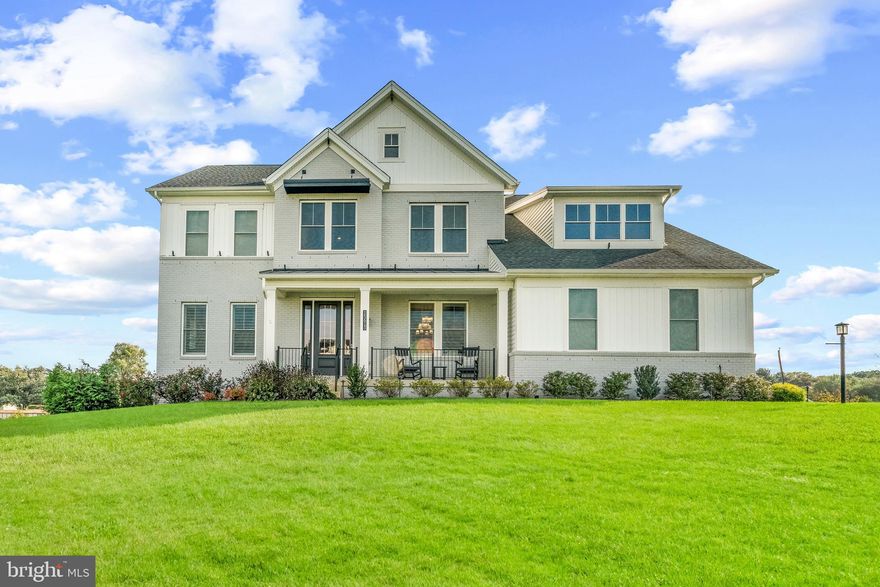 This stunning custom colonial in Linden Grove sits on a beautifully landscaped one-acre lot with panoramic pasture views and was newly decorated in 2024 by the original owners. Built in 2021, the home features modern comforts such as an eight-speaker indoor/outdoor Sonos® sound system and a four-zone Ecobee® HVAC system. The kitchen and bathrooms were recently renovated in 2023, enhancing the home's luxurious appeal. The stunning modern exterior features a blend of stone and siding, complemented by landscaping and hardscaping. The property includes a finished two-car garage with Elfa® custom shelving, an extra-wide private driveway, and an additional parking pad. Enter through the charming front porch into an open-concept main level adorned with hardwood floors, elegant Phillip Jeffries® wallcoverings [2023], and oversized crown moldings [2023] throughout.

Begin in the grand foyer adorned with custom millwork [2023] and a stunning Arteriors chandelier. To the left, discover an expansive study featuring a custom glass barn door and built-in shelving. On the right, a large dining room boasts oversized crown molding and exposed wood beams, creating an inviting atmosphere perfect for formal gatherings. Pass a stylish powder room before entering the gourmet eat-in kitchen, a culinary haven featuring top-of-the-line Thermador® appliances—including a 66” column refrigerator and freezer [2023]—and custom ceiling-high Timberlake® cabinets, enhanced by interior and under-cabinet lighting. This beautiful space showcases Calacatta quartz countertops, a handmade Italian backsplash, an island with seating, and a Brilliant Lighting® system. Adjacent to the kitchen is a convenient mudroom providing access to the garage. Effortlessly entertain and dine in the adjacent breakfast room and expansive great room, the main floor's centerpiece. This inviting area boasts a striking floor-to-ceiling porcelain-tiled fireplace, a custom ceiling-height shiplap accent wall, and multi-panel sliding doors that open to a spacious screened-in porch featuring a gas fireplace, recessed lighting, and a sleek ceiling fan. Additionally, the main level includes a thoughtfully designed multi-generational suite with a cozy sitting area, a custom kitchenette, a walk-in closet, and a full bathroom.

Upstairs, you'll find four spacious bedrooms equipped with Elfa® closet shelving systems, three full bathrooms—including one with dual entry from two bedrooms featuring dual sinks—and a beautifully designed laundry room complete with storage, a sink, and a butcher block countertop. The luxurious primary bedroom boasts a cozy sitting area, two impressive walk-in closets, and a breathtaking spa-like bathroom that features a Kohler® digital shower interface with a rainfall showerhead and body sprays, a stunning custom stonework accent wall, a freestanding bathtub, eclectic light fixtures, and dual vanities. The lower level features a stunning custom full wet bar [2023]  adorned with quartz and tiled walls, complete with a stainless steel sink, dishwasher, and ice maker. Enjoy cozy gatherings around the electric fireplace [2023] with its stacked pebble surround, complemented by ample floating shelves and built-ins. This level also includes a private mirrored workout room, a full bathroom, a versatile bonus room/bedroom, and a sunroom or lounge with exterior access. The enchanting outdoor spaces include a stunning Trex® deck that steps down to a stone and semi-covered patio, complete with a dream outdoor kitchen, equipped with a stovetop, five-burner grill, refrigerator, storage drawers, pergola, and a pizza oven. A captivating 25-light custom Kichler® exterior lighting system enhances the ambiance, while the property backs to a vast, flat, open, and fenced green space, offering serene pasture views.