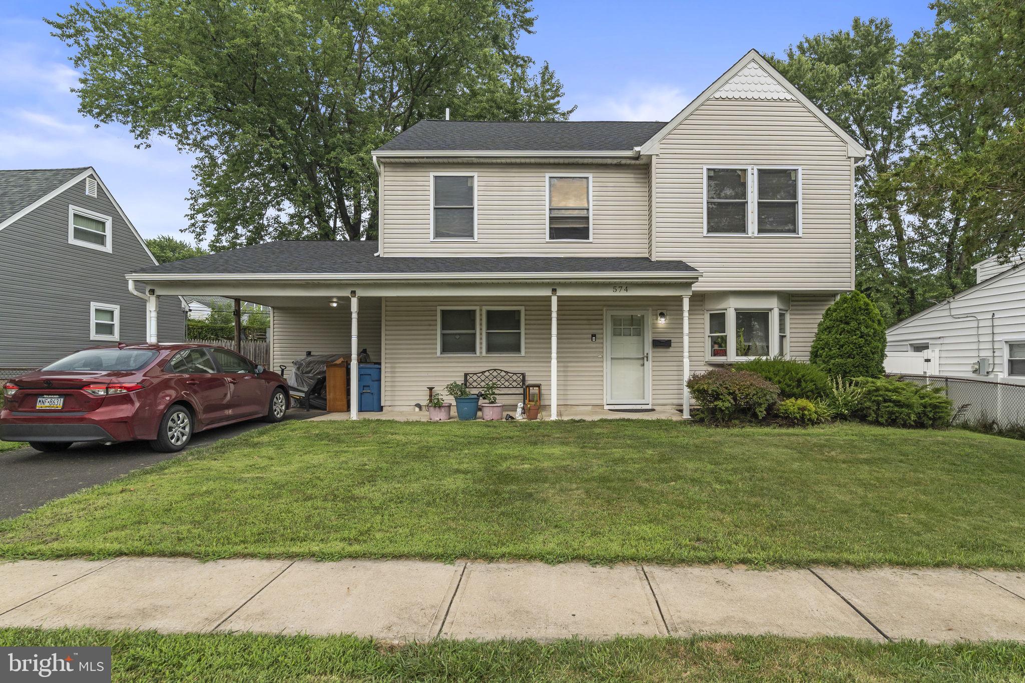 Welcome to 574 Wilk Drive, a beautiful 4-bedroom, 3-bathroom home on a quiet street in Morrisville, PA. This well-designed layout features a first-floor bedroom and two full bathrooms, ideal for multi-generational living. The updated kitchen boasts granite countertops, stainless steel appliances, and soft-close cabinetry, flowing into a dining room with hardwood flooring. The spacious bonus room offers versatility for a second living area, office, or playroom. Enjoy a fully fenced backyard, a covered carport, and a welcoming front porch. With shops, parks, and schools nearby, this home strikes a perfect balance between comfort and convenience. Don’t miss the chance to make it yours!