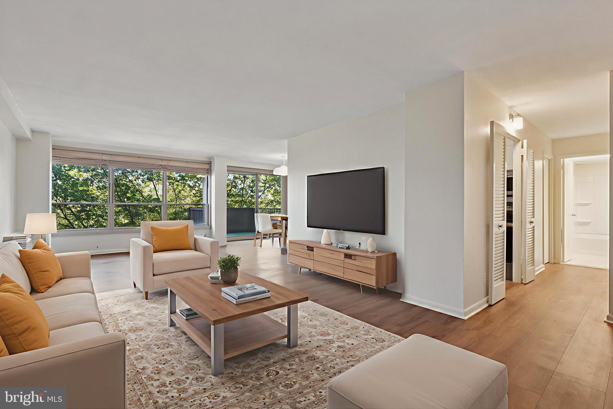 Enjoy the feeling of residential living with a resort feel in the heart of the main line and centrally located. Situated on 23 wooded and landscaped acres with lots of trees, it feels like a private oasis! You'll be impressed with a long list of ammenities as well. Inside unit 801 you'll be greeted by newly installed luxury plank flooring throughout the unit, wall to wall windows with views of trees and the outdoor pool in a spacious, open, light-filled space. Fresh paint in light neutral shade throughout, just bring your furniture and decor and settle in! This unit has been meticulously renovated to be clean, fresh and modern. The galley-style kitchen has been outfitted with new, crisp white cabinets, beautiful countertops and a stunning subway style backsplash. A new stove has also been added and the refrigerator is included. The bedroom is spacious with one large window wall and great views. A new bathroom awaits as well in bright white and ready for your personal touches. Washer and dryer are included with the unit as well as new roman shades in the living area and vertical blinds in the bedroom. Outside enjoy your balcony sights and sounds and the fresh breeze. The list of ammenities is a long one. 24 hours security, outdoor swim club ( fee required), fitness center with indoor pool ( fee required),tennis courts, game room, playground,library, banquet rooms available for rental fee,free shuttle, storage lockers and more. This unit comes with an 8'x8' private storage space located in the basement, ample free parking. All this awaits in a centrally located space close to main roads, highways, hospitals, schools, shopping, restaurants and more. The monthly condo fee covers all utilities except cable.