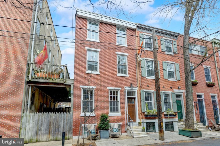 Tastefully renovated 3 bedroom, plus finished lower level, 2.5 bath home with walk-out deck and 1-car PARKING. This home offers perfect space on a quiet, tree-lined Rittenhouse Square block. One of the most desirable blocks in the city! South facing home with big windows for superb light; open first floor plan with high ceilings, hardwood floors, gas fireplace, and an awesome kitchen with white shaker cabinetry, quartz countertops and eating bar, and stainless steel appliances. Excellent storage space. The lower level is a generous, beautifully finished family room plus plenty of room for a home office, a fireplace, and renovated half bath. The 2nd floor offers two comfortable bedrooms, a full tile bath, and a laundry closet. The third floor is a stunning primary suite with cathedral ceilings, ample closet space, and a gorgeous primary bathroom. A walk-out deck between the 1st & 2nd floors that you will always use. This renovated home offers 1-car parking; is in superb condition; and is situated on a neighborly, quiet, tree-lined block in the Greenfield School Catchment. 99 WalkScore. Walk to the city's best restaurants, cafes, shopping, markets, farmers' market, parks, and more.