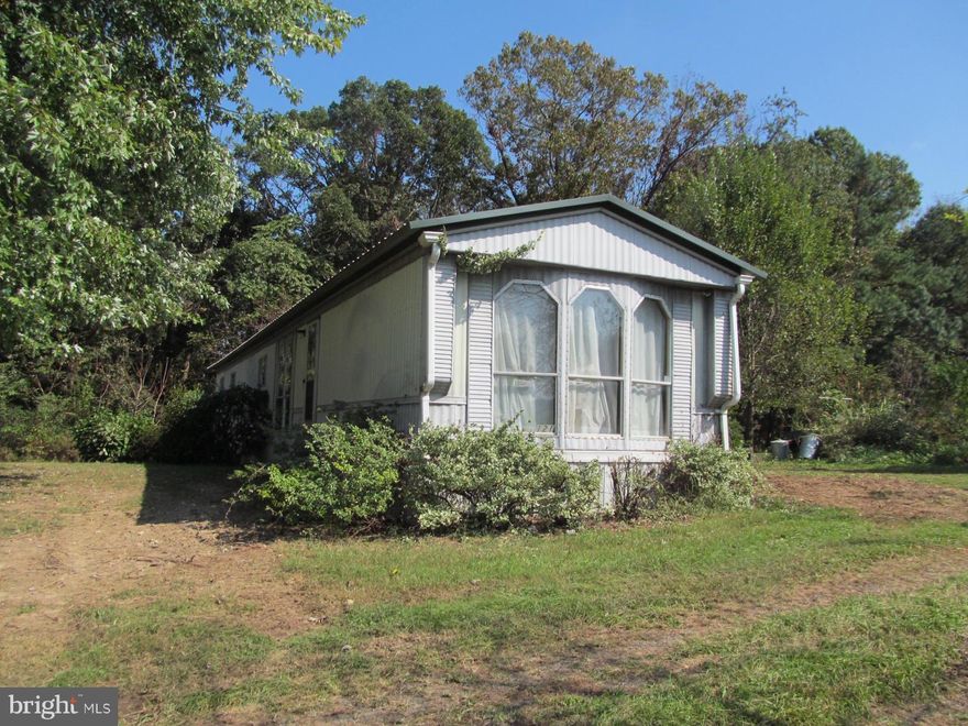 Three acres with well and septic and a mobile home being sold strictly "As Is". Cash or conventional financing only. Client must be accompanied by a sales person and at your own risk (possible mold present). Do not let the cat into the home! No drive bys.