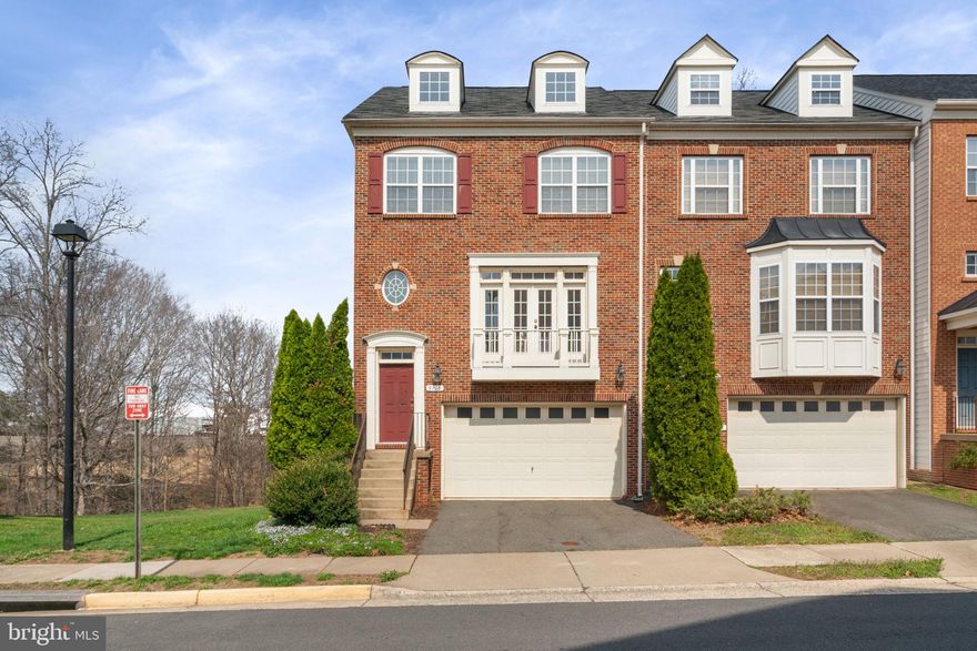 OPEN HOUSE SUNDAY 3/29 1-4 PM
Spacious & sun-filled brick front end-unit townhome.  Located on a quiet street and backing to a wooded area, The home features 3 bedrooms and 3.5 baths,  2 car garage and 2 car driveway. Upstairs, the large primary bedroom has a walk-in closet, and the primary bathroom features a soaking tub, 2 vanity sinks, and walk-in shower. The Washer and Dryer are on this level. Two other bedrooms and a full bath with tub/shower complete the level. Main Level has spacious family room, dining room , kitchen and living room.  Kitchen has granite countertops, maple cabinets and stainless appliances - Gas cooking 
The lower level with vaulted ceiling has a gas fireplace, full bath, and walk out. Manassas Park Station Community has on-site management, an outdoor pool, and a paved walkway to the VRE station.