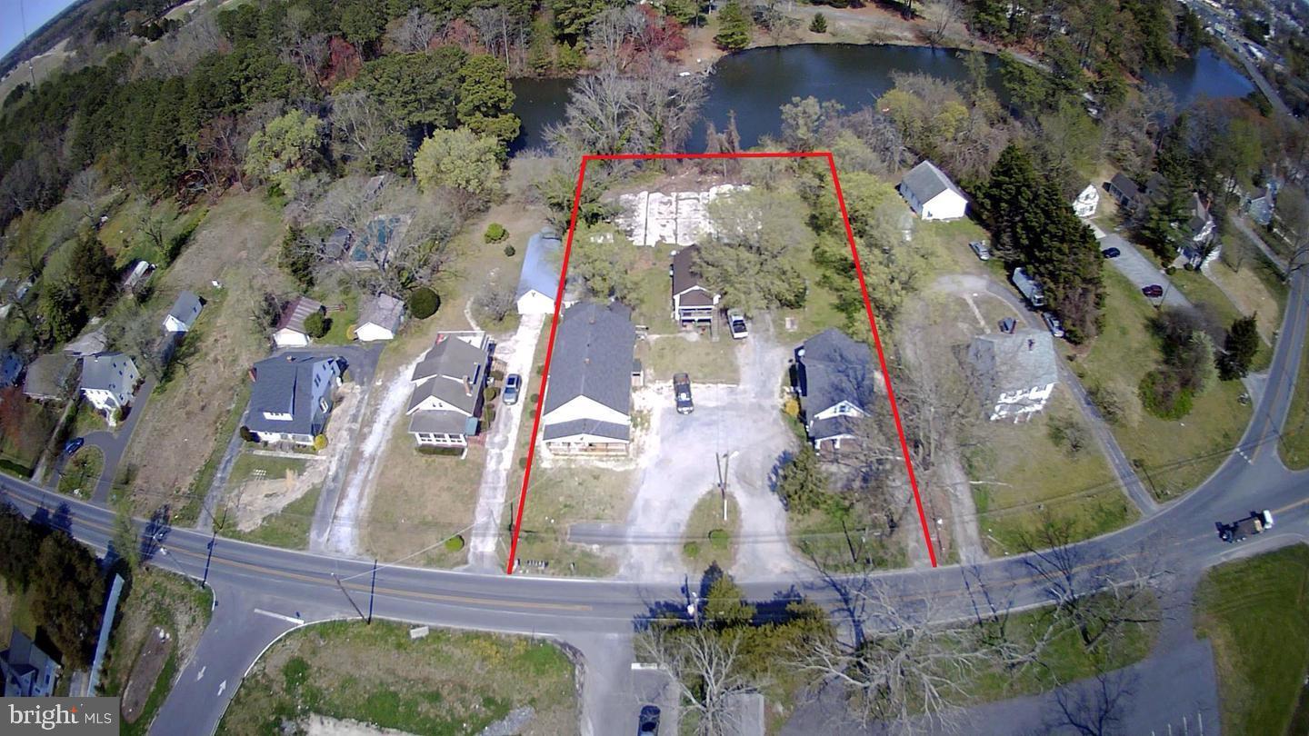 Prime Development Opportunity! Currently set up as 8 units, These two parcels (28646 and 28650), totaling 1.15 acres, are in the final stages of annexation into the city of Salisbury. Once finalized, they will offer access to public water and sewer and will be zoned for up to 12 units per acre. Preliminary plans have been designed for 12 townhomes, or take advantage of the booming rental market with multifamily condo buildings. With direct frontage on a scenic lake, this property presents the perfect opportunity to create a premium waterfront community. Don’t miss this exceptional investment potential!
Conceptual layouts, plans, plats, etc are available upon request. Currently rented and professionally managed. Showings are NOT available without letter of intent, proof of funds, etc.