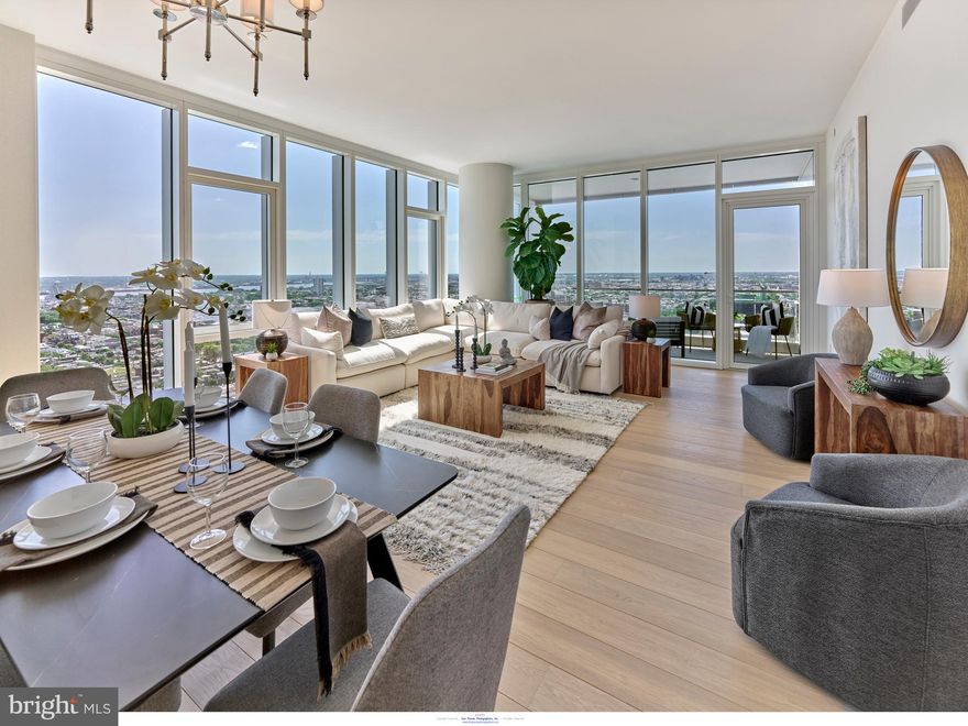 A FULLY FURNISHED, FULLY WOW DECORATED 2BED, 2.5 BATH, 1817 SF single-level residence with Delaware River and southern views priced at $1,575,000! Welcome to Arthaus, a commanding new residential high-rise in Philadelphia’s performing arts district. 

This maintenance-free, move-in-ready corner home offers high-end interior design, resort amenities, white glove services, and the utmost privacy. Tax abatement is available.  Whether you're a busy professional, retiree, or globe trotter, 2302 is a MUST-SEE!

Arthaus impresses you from the moment you arrive. The beautifully grained, solid wood front door swings open to a gracious foyer that's long and spacious, perfect for displaying an art collection. There's also a powder room and coat closet. The entrance meets a hallway to the sleeping wing, where you'll find the laundry area.

Straight ahead is the great room with unobstructed Delaware River and bridge views. Soaring ceilings, floor-to-ceiling windows, wide-plank Havwood flooring in Salvo, and a weather-protected walk-out balcony make the great room feel bright and airy, with plenty of space for entertaining or relaxing with loved ones. Situated on the southeast corner of the building, the views go for miles without a single obstruction making the home feel totally private and tucked into the sky.

The chef’s kitchen is ready for every occasion, with a stylish large center island that seats four. The white and silver ash white cabinets by Poggenpohl add a crisp look that commands attention. Golden Gate Quartz covers the counters and backsplash. The high-end stainless appliance package includes Wolf, Bosch, Sub-Zero, and Asko appliances. The door fronts have been fully integrated into the cabinet design for a seamless, high-end, polished look.

The primary suite and one guest bedroom are on the east side of the condominium, with river and bridge views. The second bedroom has an ensuite bathroom and is a perfect spot for visiting guests. They'll love the east-facing views of NJ. The guest bathroom has a walk-shower tiled in Porcelain Calacatta, a Kohler toilet, and Poggenpohl single sink vanity in polar white matte topped with super white quartz. The elegant owner's suite has a large walk-in closet and a generous sleeping area with river and Jersey views. The best-in-class bathroom package includes a Badeloft soak-in tub, double vanity with Robern mirrors, super white quartz marble and Poggenpohl cabinets, Olympic Sky grey marble floors and shower tile, and a Kohler toilet closet.

Arthaus is a modern masterpiece crafted by renowned developer Carl Dranoff, designed by Kohn Pedersen Fox, and built by Intech Construction. Its architecture and amenities prioritize wellness and well-being, from the stunning Monet-inspired mosaic in the lobby to the private resort on the 6th and 7th floors, featuring a pool, fitness facilities, spa, salon, pet park, outdoor terraces, lawns, gardens, and more. White glove services include a 24-doorman, concierge, chauffeured town car, and valet. 

This home comes with 1 parking license. With the tax abatement, annual real estate taxes are approximately $3,443