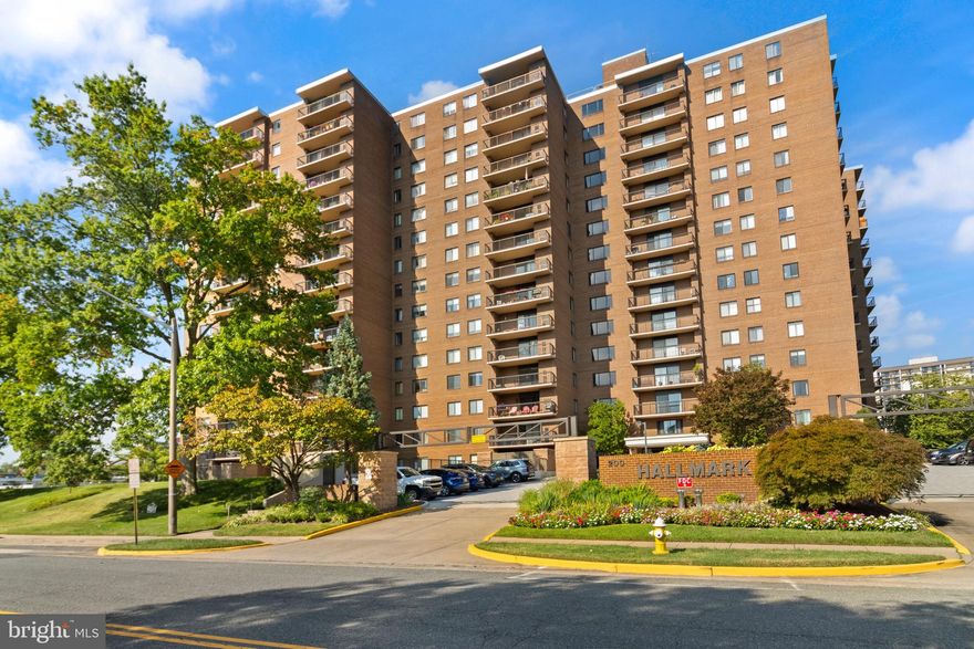 **PRICE IMPROVEMENT** Bring all offers! Welcome to The Hallmark Condominium in the City of Alexandria! This move-in ready 1-bedroom, 1-bath home offers over 900 sq ft of stylish living space, freshly painted and tastefully updated throughout.

Step inside to a spacious open layout with a dedicated dining area, highlighted by a brick accent wall that adds character and warmth. The oversized bedroom features a large window that fills the space with natural light, a generous walk-in closet, and easy access to the updated full bath. A private balcony overlooks the community pool, perfect for relaxing or entertaining.

The Hallmark offers garage parking, controlled building access, and amenities including a pool, and gathering spaces. Conveniently located near the Landmark Mall redevelopment, this home sits within Alexandria city limits with quick access to Metro, Old Town, Reagan National Airport, and major highways. The windows and patio doors are being replaced as part of the condo renovation project.  A rare combination of comfort, convenience, and value in a growing location—schedule your showing today!