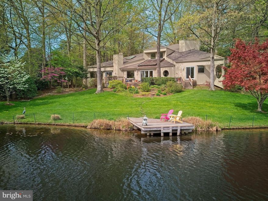Rare opportunity to purchase a truly special home on one of the premier waterfront lots in Reston.  This custom contemporary offers amazing views of Lake Newport from large glass spaces, double decks and a private dock overlooking the lake.  Quiet, end-of-cul-de-sac location and a truly stunning home filled with architectural interest, and loaded with extras rarely found in today's listings.  A Pro Via Rain Glass front double door leads you into the two-story foyer featuring a new "lotus" chandelier and dual skylights.  Lighted stairs lead to the spacious living room with a cathedral ceiling and offering an electric fireplace surrounded by lighted display shelving.  A sliding glass door leads to the rear deck.  The dining room, also accessible from the foyer and from the kitchen, features an iconic circular window from architect, Peter Gravitt,  Another large window overlooks the serenity pool.   A fully renovated powder room offers a granite-topped vanity with an under-mount sink, contemporary lighting and a display shelf behind the commode. The chef's kitchen includes granite counters on soft-close cabinets with under-cabinet lighting, a lighted "bar area" and up-dated stainless appliances.  An adjoining two-story breakfast area includes amazing lake views and a custom, glass half-wall overlooks the family room.  Two lighted, ceiling fans and six skylights  are all located in the wood-framed family room.  Another custom, round window offers views to the back and side yards, as does the sliding glass door that leads to the spacious deck.  A fully renovated powder room includes a granite-topped vanity with an under-mount sink, contemporary lighting and a display shelf behind the commode.  The primary suite also features amazing views to both the deck, accessible from the room, and the lake.  A cathedral ceiling and a spacious, customized walk-in closet with a separate wall closet for linens complete the primary bedroom.  The adjoining primary bathroom includes a rope-lit, double sink vanity with a magnifying make-up mirror, a separate shower, a soaking tub and a skylight.  Bedroom 2 has a private deck, with a lake view, a walk-in closet and an adjoining full bathroom.   Whether you're working from home, or just enjoying personal computer time, you'll love the upper level desk spaces with their lake views!  Bedroom 3 is spacious and just a few steps from the third full bathroom.  This bathroom is fully renovated with a granite-topped soft-close wood vanity, with an under-mount sink and a custom lit contemporary mirror.  The exterior of this fabulous home is very special with a 62' main deck offering an amazing space for entertaining friends and family with views you can't get enough of!  Lots of special landscaping with brilliant, blooming trees and plants from early spring to late fall.  Launch your kayak or canoe from the private dock at lake's edge, or drop your line and see what you can catch.  Just sit on that dock and soak up the amazing views of the lake in all seasons.  Reston's fabulous amenities including the pools, tennis and basketball courts, baseball diamonds, soccer fields, playgrounds, miles of pathways, picnic pavilions, pickle ball courts, garden plots, The Lake House and Walker Nature Center are all easily accessed and offer so much fun and interesting programs.  North Point Village Center with its shops, Star Bucks and restaurants, and Reston Town Center with its free outdoor concerts, Tephra Institute of Contemporary Art , theater, restaurants and shops are all just minutes away.  Dulles Airport and multiple Metro Stations are also nearby.  But, at day's end, the best part of living here will be the meaningful and unique space with FABULOUS water views that you call home.