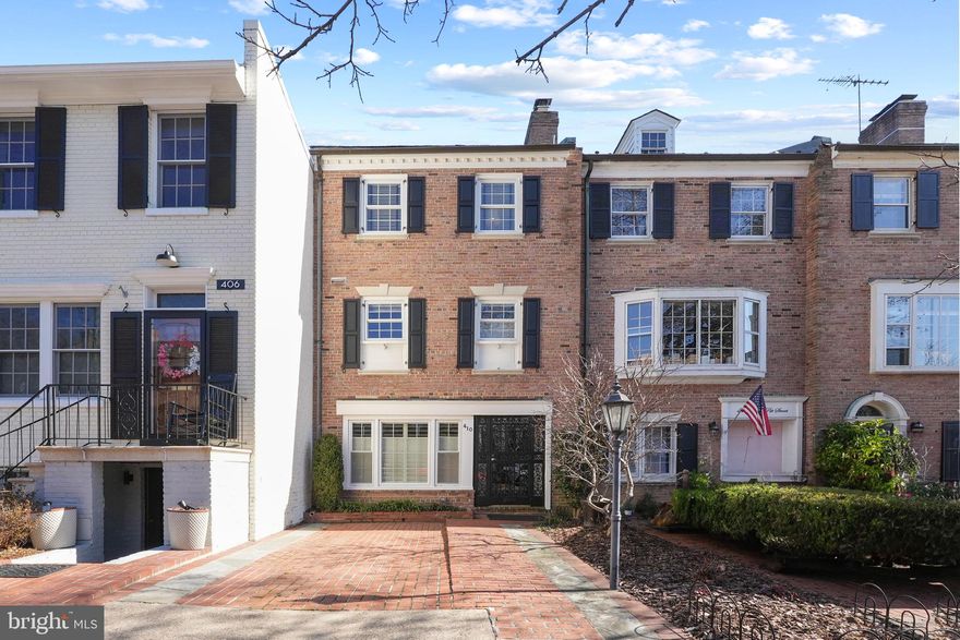 Cupid’s arrow will instantly strike the moment you walk into this property. 410 S Pitt Street is a townhome located in the sought-after SE Quadrant of historic Old Town. Fall in love with being close to restaurants, quaint shops, the Potomac River waterfront, and trails, and the extraordinary future lifestyle you can have. 3 levels, 3 bedrooms, 3.5 baths, hardwood floors, crown molding, chair rails, recessed lighting, and neutral paint colors. Beautiful family room with wood-burning fireplace flanked by custom bookshelves and freshly installed plush carpet for added comfort. Entry level with bedroom and full bath is ideal for guests and has a laundry closet with great storage options. Deep and private outdoor space with a flagstone patio and a shed, makes the perfect environment to kick back with friends and family. Main living level is an open and bright space comprised of a kitchen, dining room,  living room, and a half-bath. Kitchen features granite countertops, stainless appliances, soft-close cabinets/drawers, and ample storage with a pass-through window to the dining area for maximum convenience for everyday meals or while entertaining. Living room offers the home's second wood-burning fireplace, more custom built-ins, and a large window that overlooks the backyard. The upper level provides two bedrooms, each with an ensuite and ample closet space. Primary boasts two separate closets with french doors, and an updated bathroom with a  glass door walk-in shower with bench. Second bedroom showcases a built-in desk perfect for a remote work/school setup and also flaunts an updated bathroom. The coveted brick paver driveway provides off-street parking for one car. Don’t miss this opportunity!