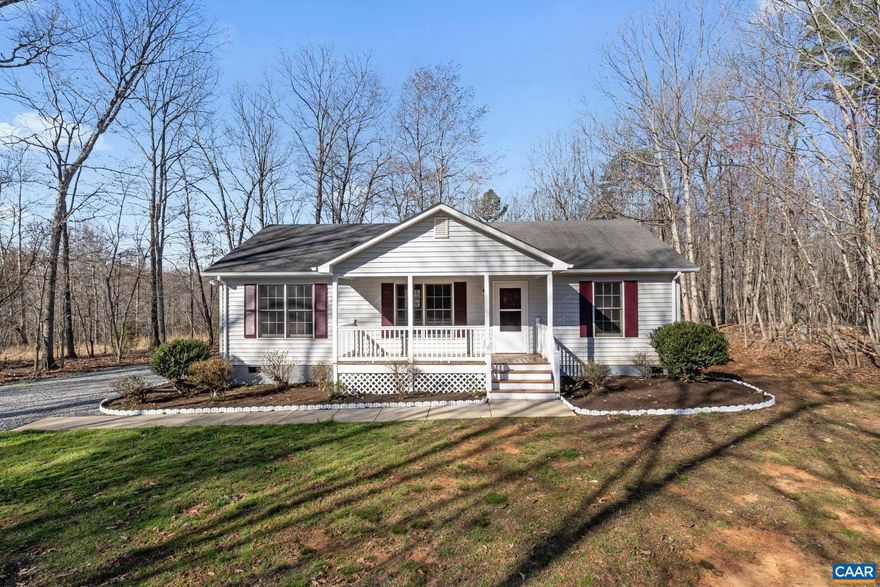 Wonderfully updated ranch with an inviting covered country porch and a large rear deck on a private 4.7 acre lot.  This home offers 3 bedrooms, 2 full baths, wood floors, vaulted ceilings, fireplace, full appliance package, and two sheds for additional storage.  If you have been looking for a first home or looking to downsize, this is truly a great floor plan.,Formica Counter,Wood Cabinets,Fireplace in Living Room