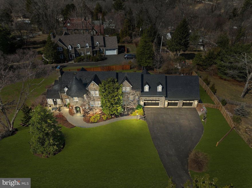 This extraordinary Jenkintown home went under a total home renovation in 2023 seamlessly blending modern upgrades with its timeless original charm truly making it one of a kind. Nestled on a one acre picturesque corner lot with mature trees, this stunning stone residence offers a serene retreat while exuding unmatched curb appeal. From the moment you arrive, the castle-like turret entrance and expansive stone façade make a lasting impression.

Step through the arched main doorway into a welcoming foyer with elegant stone flooring, offering ample space for furniture to create a cozy yet grand entrance. Designed for effortless entertaining, the main level boasts clear sightlines from end to end, complemented by brand-new light-toned hardwood flooring, recessed lighting, and a fresh neutral color palette that brightens every space.

The inviting living room features an oversized gas fireplace, perfect for cozy winter evenings. Flanking the fireplace, glass-paneled doors lead to an expansive sunroom with a newly vaulted ceiling and automated window treatments. A charming farmhouse-style door from the sunroom opens onto an inviting patio, beautifully lit by bistro lighting—an ideal spot for outdoor gatherings.

Adjacent to the living room, the spacious dining area comfortably accommodates seating for eight, with additional space for lounge furniture—perfect for an after-dinner cocktail. The heart of the home, a breathtaking chef’s kitchen, showcases an 11-foot seamless quartz center island, a dedicated coffee or bar area with a built-in beverage fridge, and custom cabinetry. A newly carpeted secondary staircase off the kitchen provides convenient access to two additional bedrooms and a hall bathroom.

Completing the main level are a stylish powder room, multiple storage closets, and access to the basement through a pocket door.


Upstairs, the primary suite is a true sanctuary, featuring a cozy fireplace, an upgraded en-suite bath with an oversized shower, and an incredible walk-in closet with custom built-ins. Down the hall, two additional bedrooms share a beautifully updated Jack and Jill bathroom, while a private guest suite—with its own full bath—sits at the far end of the home. Accessible via the kitchen staircase, this secluded space is perfect for an au pair, in-laws, or visiting guests.

Unparalleled Garage & Bonus Spaces
The home’s three-car garage is a standout feature with limitless possibilities. Bay #1 is heated with extra-tall ceilings—perfect for a home gym, classic car storage, or even a golf simulator. Bays 2 and 3 are spacious and connected, offering a full staircase leading to a massive loft spanning the width of the garage. Whether transformed into a game room, home office, or creative studio, this bonus space is brimming with potential.

1300 Gilbert is conveniently located to septa regional rail transportation making it a breeze to get into center city or other points of interest. It is also close to major shopping areas such as The Fairway and downtown Jenkintown where you can enjoy excellent dining options and a variety of small businesses. 

Don't hesitate to schedule your tour of this immaculate home before it's gone!

Additional Upgrades:
Newer Hot Water Heater (2022) 
Routine Roofing Repair and Maintenance (2023)
Fence (2024)
All New Pella Windows  (2023) (Exception of basement and downstairs garage windows)
New Driveway (2023)
Completed Updated Electrical (2023)

Additional Highlights:
Slate Roof – Timeless durability and character
Oversized Slate-Top Window Sills – A refined architectural touch
Completely Fenced Backyard (2024) – Private and pet-friendly
Gas Fireplace - makes starting a fire a breeze 
Automated blinds in sunroom - provides sunlight or full privacy in just a few seconds