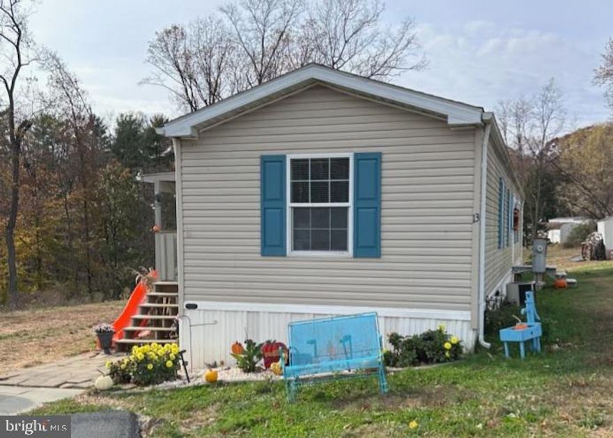 Welcome home!  This 2006 singlewide is move in ready and offers many updates from the current sellers.  Situated on a corner lot neighboring the  woods you will see plenty of wildlife.  A covered side porch great for bbqs and entertaining in the summer.  Three bedrooms and two full bathrooms and updated flooring gives enough room and would be a great starter or downsize home.  With the lot rent being one of the lower in the area ($615.00 buyer to verify with park management) this is a sought after area.  Just minutes to PA and Harford County but yet offering privacy.  Community playground also.  Pictures to come this week.  Do not miss out on this home.