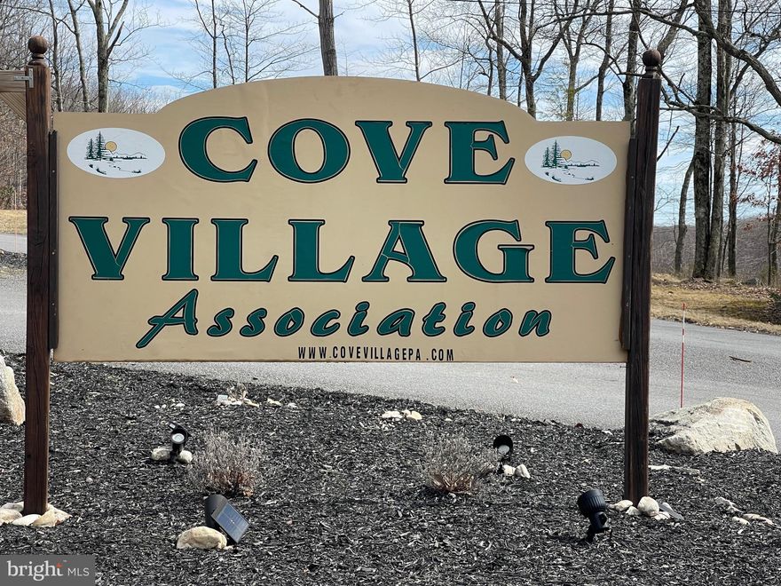 Looking to build in 2026 or beyond?  Secure your lot today!  Situated close to the community entrance and near the recreation area this is a great lot ready for you!  Whether you've been imagining building a second home or just waiting to build that forever home, WAIT NO MORE!  The Cove Village Community is situated in the foothills of the Poconos and only 1 1/2 hours to New York,  With easy access to I-81 your commute to Hazleton, Wilkes Barre, or Scranton is a breeze.  Bring your own builder and let's get started.   Another cost-saving perc of the community is having public water and sewer already in place and ready for you to connect through Aqua of Pa.   750 acres of unoccupied prime hunting, ATV, and snowmobile riding land surround the residential portion of Cove Village and is allocated only for the residents of the community and their guests!  Driving through the community, the peace and tranquility will envelop you.  At any given moment the deer, turkey, and birds will entertain you in your own backyard.   Homes within the community vary from rustic cabins and chalets to traditional ranch or two-story homes and even exquisite new construction or dreamy mountain log homes.  There really is something for everyone.  The approximately 278 acres of residential homes and lots are occupied by full-time residents, part-time vacation homes, and even some snowbird second homes.  Cove Village offers an abundance of amenities including a swimming pool, stocked fishing lake, a basketball court, tennis courts, a volleyball court, 2 playgrounds, a baseball field, ATV paths, hunting, a mini golf course, walking paths, and year-round Community events.  I can't forget to mention the beautiful lodge ideal for renting for family gatherings.   This lot and community just might be exactly what you've been looking for.  Air B and B are not permitted. Camping on vacant lots is not permitted.  Mobile homes are not permitted.  Modular homes are permitted. The minimum square footage when building is 1400 square feet.  The community maintains the roads and snow removal.  Trash collection is also provided.   An appointment is required to view due to the gated community.  Call to schedule your tour today!
