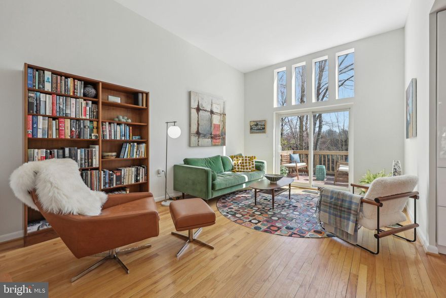 Beautifully designed mid-century modern townhome nestled in the peaceful Lake Anne access community in Reston, Virginia. This spacious four-bedroom, two-and-a-half-bathroom residence with 2 assigned covered parking spots offers 2,514 square feet of thoughtfully designed living space, blending architectural charm with modern comfort. The home’s unique multi-level layout provides flexibility and privacy, featuring two bedrooms on the upper level and a primary suite along with an additional bedroom on the third level.  

The recently remodeled kitchen is a standout feature, boasting all-new appliances, including an induction cooktop and built-in microwave. A stunning solid walnut island and open shelving add warmth and elegance, enhancing both functionality and style. The open-concept design seamlessly connects the kitchen to the dining and living areas, making it an inviting space for cooking and entertaining.  

The outdoor living spaces are just as inviting as the interior, offering multiple areas to relax and entertain. A private courtyard at the entrance creates a welcoming first impression, while the rear deck provides a perfect spot for outdoor dining and enjoying the tranquil surroundings, including peekaboo lake views. A covered patio offers additional shaded space to unwind, making it easy to enjoy the outdoors in any season. Residents also enjoy exclusive access to the Inlet Cluster community dock on Lake Anne, perfect for launching kayaks, paddleboards, or simply taking in the serene waterfront setting.  

Conveniently located with easy access to major commuting routes, this home is just minutes from the Dulles Toll Road, Route 7, and Wiehle-Reston East Metro Station, making travel to Washington, D.C., and surrounding areas effortless. Washington Dulles International Airport is only six miles away, ideal for frequent travelers.  

Residents of Reston enjoy a wealth of amenities, including miles of walking and biking trails, scenic lakes, and abundant green space. Reston Town Center is just minutes away, offering premier shopping, dining, and entertainment options, along with year-round community events. The Reston Association provides access to community pools, tennis courts, and golf courses, ensuring an active and engaging lifestyle.  

Located within the highly regarded Fairfax County Public Schools district, this home offers an excellent educational environment. With its blend of timeless design, modern upgrades, and access to Reston’s outstanding amenities—including the Inlet Cluster community dock on Lake Anne—1503 Inlet Court presents an exceptional opportunity to experience the best of Northern Virginia living.