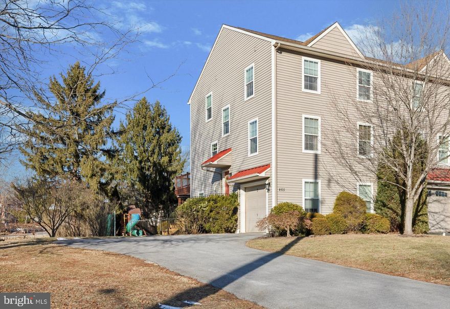 Welcome to 465 Chestnut Street, where small-town charm meets city conveniences in the heart of Collegeville! This 3-bedroom, 2.5-bathroom home offers a thoughtful layout with an abundance of natural light and modern features.  Step into the inviting great room with soaring ceilings and a striking 3-story foyer. The main level boasts 9-foot ceilings and a seamless flow between the spacious family room, dining area, and kitchen. The kitchen is a chef's delight, featuring newer granite countertops, 42" cabinets, hardwood flooring, and coordinating appliances. Sliding glass doors lead to a new deck with scenic backyard views, perfect for outdoor dining or relaxing. A powder room on this level adds everyday convenience.  Upstairs, the primary suite offers a peaceful retreat with a modern en suite bathroom and ample closet space. Two additional bedrooms, each with large closets and natural light, share a centrally located hall bathroom. The finished walk-out basement, also with 9-foot ceilings, provides flexible space for a home office, gym, or recreation room. Outside, enjoy a generous, level backyard with a newly added paver patio complementing the deck—perfect for entertaining.  Unwind outdoors in all weather from the safety of the covered patio, keeping you secured from the elements.  The oversized one-car garage offers plenty of storage for bikes, tools, and more. Conveniently located near parks, shopping, restaurants, major transportation routes, and the Perkiomen Trail, this home offers the best of suburban living. Don’t miss your chance to make 465 Chestnut Street your new address!