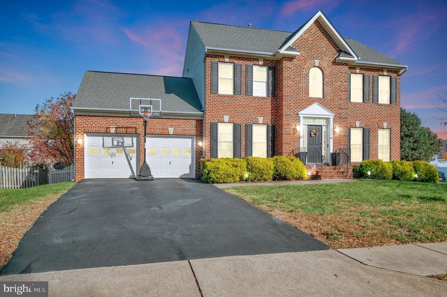 Home is where the pool is! This beautiful brick home is in sought after River Club on a corner lot with a custom in ground pool. Inside and out, this is an entertainer’s dream home. The main level welcomes you with 9’ ceilings and gleaming hardwoods. The spacious foyer is balanced with a formal living room and gracious dining room. Both delightfully trimmed for those formal gatherings. The gourmet kitchen boasts new stainless-steel appliances, including a double wall oven, cooktop with a down draft, island with seating and pendant lights, plentiful cabinet/counter space, pantry, breakfast table space, and access to the backyard dining area. The sizeable family room is enhanced with a large bay window, gas fireplace, and ceiling fan. The upper level features a relaxing primary bedroom with ceiling fan and walk in closet. The newly remodeled bath offers a stand-alone soaker tub as its focal point and accented with a new upgraded shower and dual vanity. This level is completed with a hall bath, three more generous sized bedrooms, and a laundry area. The fully finished lower level offers serious space for enjoyment and entertaining for the big game or birthday pool parties. There is ample space at the wet bar, A full bath, and a flex room for your choice of a bedroom, office, theater, or gym room. Walk out and up to the backyard oasis. Here you find beautiful landscaping, a custom gunite inground 8’ deep swimming pool, new concrete patio, gazebo, and more all surrounded by a private vinyl fence. Updated is the pool pump/filter, A/C units, Kitchen appliances, hardwood floors, carpet, paint, and more. Home is wired for a whole house generator. The oversized garage offers loft storage. Minutes to VRE, commuter lots, I95, shops, restaurants, military bases, and more. You do not want to miss this house!