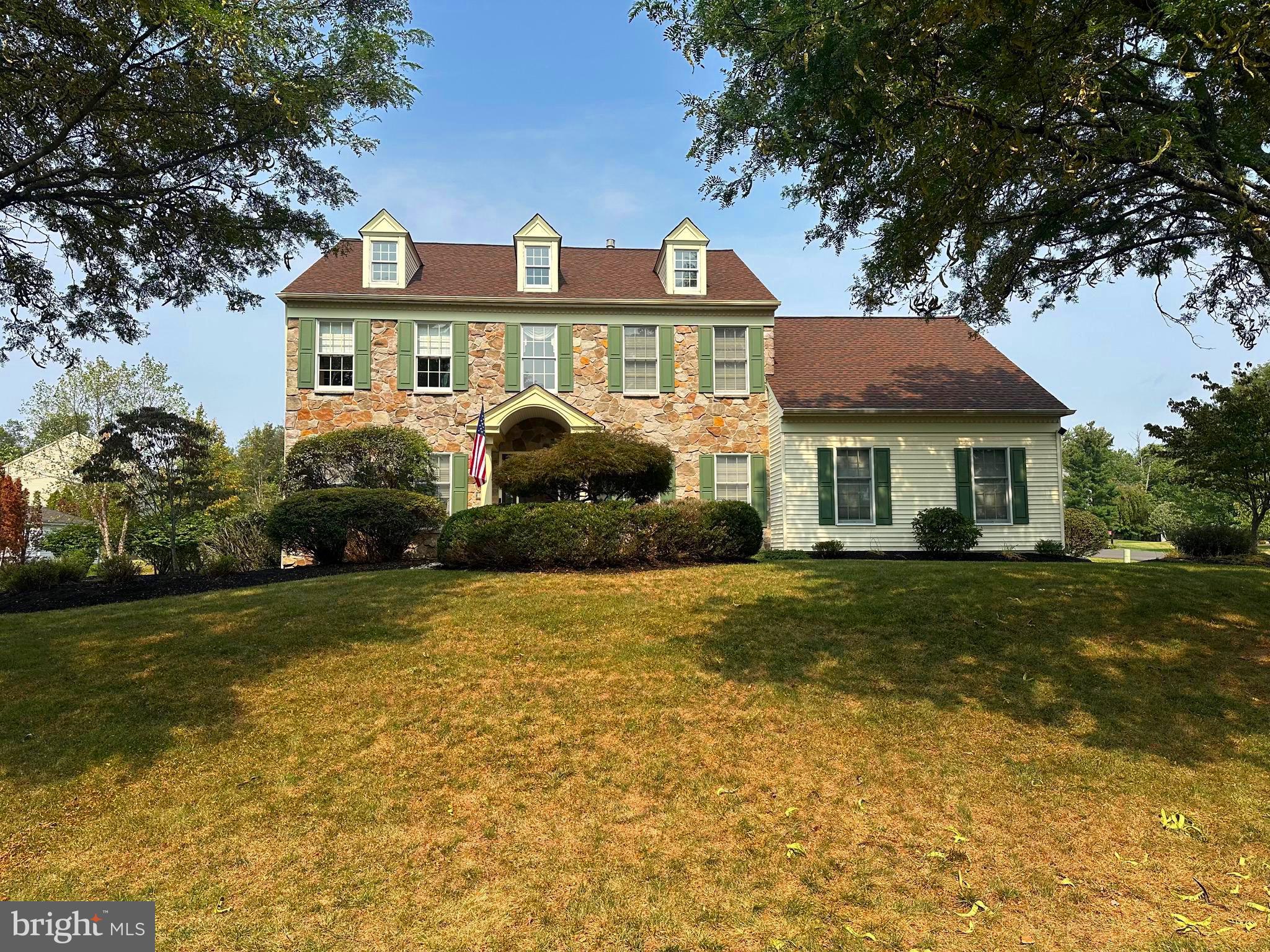 This stone front beauty, is one home you don't want to miss! Located in the highly desirable Jamison Hunt neighborhood & Central Bucks School District, this well maintained home is situated on a cul de sac street, and the neighborhood offers a community park with tot lot, walking/bike trail, tennis & basketball courts, with NO HOA. The home has great curb appeal, with stately dormers, portico & newer front door and sidelites. Once inside, the home showcases a grand two story foyer with wainscoting, hardwood flooring & a turned staircase with hardwood treads. The home has 9 ft ceilings on the first floor & an open floor plan. The formal Dining room & Living room both have crown molding. The spacious eat in kitchen has been updated & offers 42" cabinetry, granite countertops, tumble backsplash, center island, hardwoods, breakfast room & new casement windows. A replaced Anderson sliding doors leads you to the great outdoor space with EON decking and a covered hip roof, exterior flood lighting, paver patio & wall. The family room boasts a floor to ceiling stone fireplace (gas) with new windows on each side, hardwood & french doors that open to the LR, which enhance the easy flow of the home. A private office, in the back of the home, 1st flr laundry & powder room complete the 1st floor. Professionally finished, the basement is a terrific addition, offering an additional 1000 sq ft. (approx), of living space. There is a tv room with a wall of built in cabinetry, recessed lighting & newer carpeting, a game room, storage room and an additional versatile finished room with closet . Upstairs, a double door entry leads you into the spacious primary suite which has cathedral ceiling, walk in closet, pretty hardwoods & an en-suite. The primary bath has been completely renovated: Newer seamless shower, soaking tub, sinks, tile flooring, skylight & windows. Three additional bedrooms & guest bath complete the second level. Many of the big ticket items have already been replaced or added! Roof (50 yr warranty) & bathroom skylight (2016), Trane Heating & A/C (2019), some newer windows (2024), Sump Pump with hydro backup, renovated Kitchen, tile flooring in all baths, 40 amp breaker for generator, walkway to rear of home. Some additional amenities include GAS Heat, 2 car side entry garage, & professionally landscaped. Jamison Hunt is a wonderful place to call home!