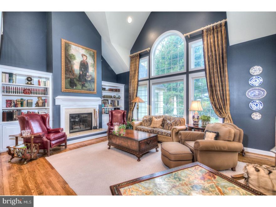 "Exquisite" is the only way to describe this very custom home like no other in Whitegate offering a flexible floor plan where you have a choice to have a First and/or Second Floor Master Suite(s). This true gem is loaded with upgrades throughout and is "perfectly sized" providing an open floor plan where all the rooms seamlessly blend together creating a harmonious flow. A two story Foyer is flooded with natural sunlight and graciously welcomes one as it opens to the elegant Dining Room  with triple crown molding and Bar Area and cozy Living Room with gas fireplace. Gleaming hardwood floors carry you into the spectacular Great Room with palladian window and custom built-in bookcases that flank the statuesque wood burning fireplace. From this dramatic space one can capture the sun filled Breakfast Room with walls of windows, tray ceiling and access to the outside Patio, into the gourmet Kitchen. This Kitchen is a chefs dream featuring top-of-the-line stainless steel appliances, large island ,granite countertops and a brilliant desk station that is multifunctional. Conveniently, this family hub leads directly into the Mudroom and Laundry Room with access to the oversized three car Garage. Graciously tucked away on the other side of the home is a stunning Library and/or First Floor Master with soaring ceilings, large walk-in closet, and full Bath with double vanity sinks, large shower, and soaking tub. A lovely staircase leads to another magnificent Master Suite that was beautifully designed by combining two bedrooms into one to create a private oasis that you will never want to leave. Stunning millwork, built-in bookcases, hardwood floors, his/her walk-in closets, and a gorgeous marble Master Bath are just some of the features that set this home apart from the typical newer home. Hardwood floors lead you to the other two Bedrooms that share a Jack and Jill Bath. The Lower Level with natural sunlight is a movie lovers dream and is completely finished with two seperate rooms providing options for a Fifth Bedroom and Exercise Room. This very sophisticated home with  pristine finishes is not your typical Mcmansion and is conveniently located near the community's private tennis courts and playground. These country club amenities promise to provide years of cherished memories with a location that is minutes from downtown Wayne, King Of Prussia Mall and all major highways. Yes..you can have it all!!