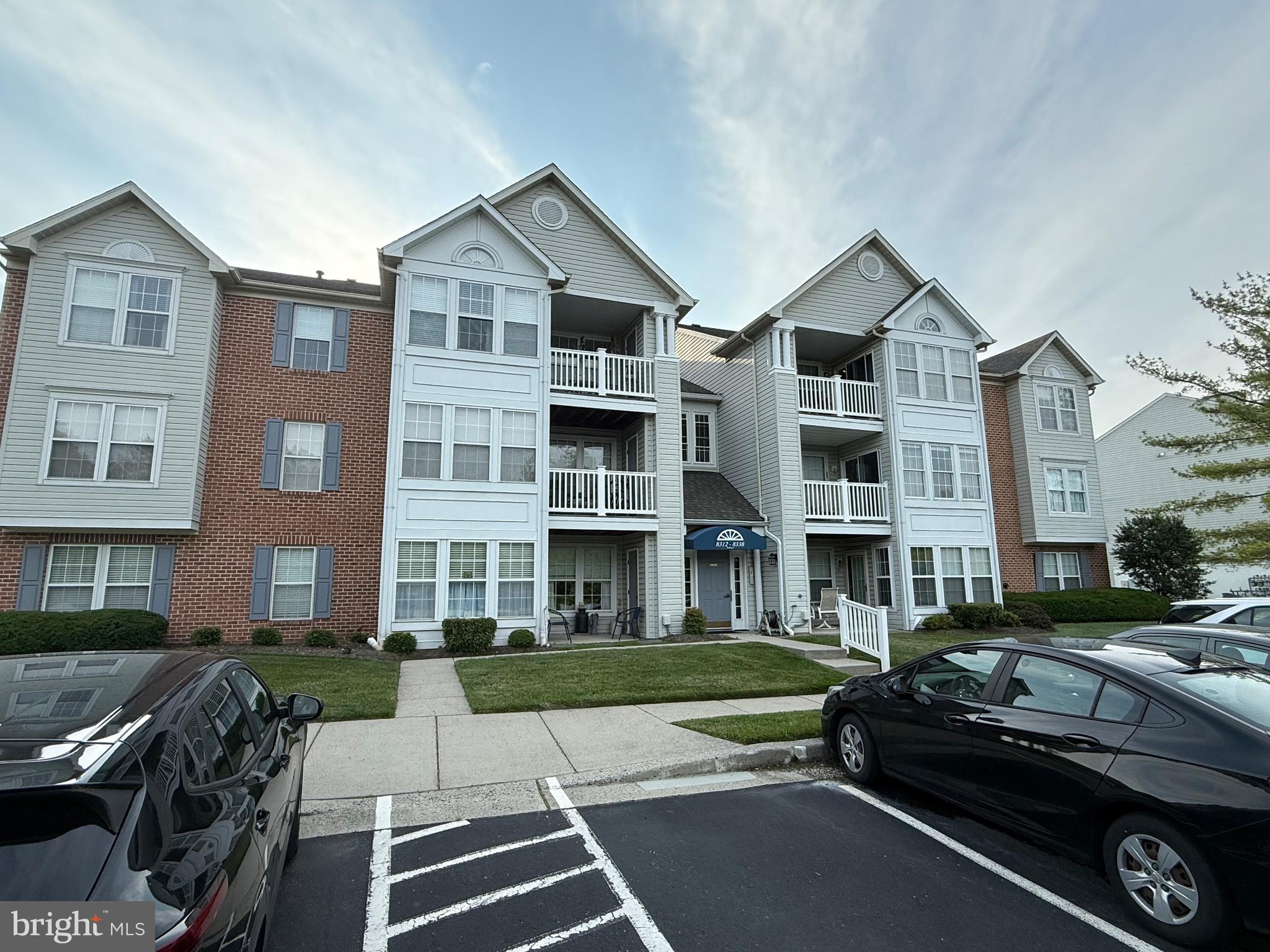 Welcome home to your own 2nd Floor Condo Unit in Poplar Mill Condominiums. Convenient to the White Marsh Shopping areas and I-95, yet a quiet community with lots of open space. This second floor condo has two bedrooms and two bathrooms. The living space is open concept and the bedrooms are separated by the living space for ultimate privacy. The living room is large and looks into the dining area and kitchen where there is a breakfast bar, white counters and white appliances. Just off the dining area is a balcony that looks out over open space. The primary bedroom has an en suite bath and there is a laundry room just off the kitchen. The second bedroom has a bathroom right next to it and is accessible from the hallway.