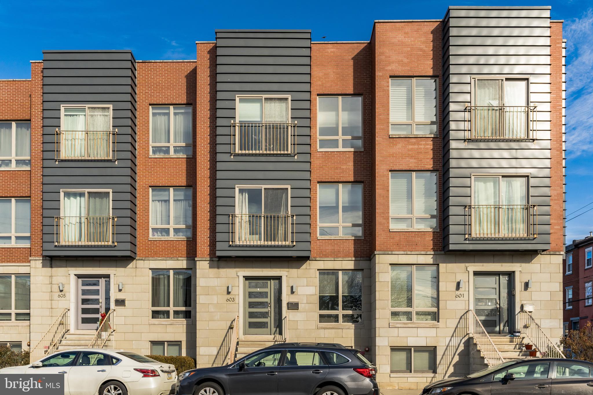 JUST REDUCED! Qualified buyers may also may be eligible for a $10,000 grant. Welcome to Poplar View Townhomes. As you enter into this 20-foot-wide contemporary home, you'll immediately notice the open floor plan, tall ceilings, and beautiful hardwood floors. This house is filled with natural light from its many windows throughout. The living room opens to a flex space (or formal dining area) and kitchen with a half bath. The spacious kitchen features a breakfast bar, island, and dining area. The kitchen is furnished with premium stainless-steel appliances, quartz countertops, ample cabinets for storage space, and a Juliet balcony. A large two-story wall of windows brightens up the entire dining area featuring a custom LED light fixture. From the dining area, you will notice the high ceilings and the loft space above that can be used as an office or playroom. In addition to the loft area, the second floor consists of a full hallway bathroom, hallway laundry and two bedrooms located in the front of the house. One of the two bedrooms features a Juliet balcony. The third floor features an additional bedroom and large primary suite with a Juliet balcony. There are three closets for all your clothes, shoes, and accessories. The primary suite is complete with an elegant bathroom having decorative tiles, dual sinks, jacuzzi tub with jets, and spacious shower enclosed with glass. Take the stairs up to your private roof deck with 360-degree views of the city. The basement features an additional bedroom or family room with a full bathroom and access to the private garage. This home is well equipped with an elevator, built-in speaker system, home automation, security system and more. Control music, lighting and temperature to every room right from your smartphone. The property is conveniently located in Northern Liberties to enjoy all of the restaurants, bars, cafes, and shops.