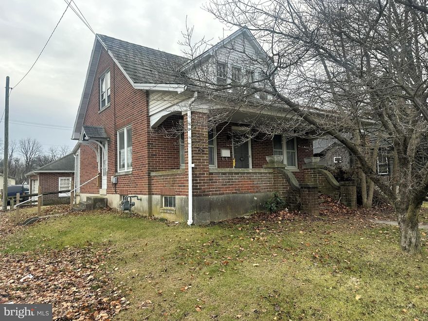 This 1 1/2 story brick, 3 bedroom, 1 bath home in South Western School District has wood floors on both levels, 1 bedroom on main level, 2 bedrooms on the 2nd level.  Front porch is 7' x 25', rear covered porch is 5' x 8', rear garden shed is 10' x 14', 2 car detached garage is 20'w x 22'd.  Currently utilities are turned off.  This property is being sold "as is".