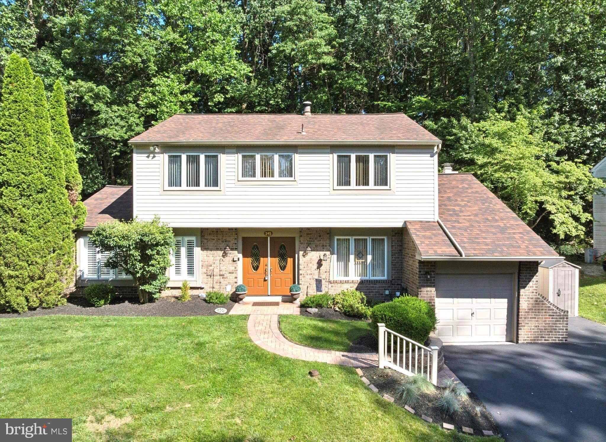 Welcome to 345 Ellis Road, situated in one of the most desirable locations in Haverford Township, directly across from the Merion Golf Club - West Course. This exceptional home offers a truly amazing indoor space, featuring four well-appointed bedrooms and two and a half bathrooms. The outdoor living experience is equally impressive, with a spacious patio that is perfect for barbecues and delightful al fresco dining. This area is ideal for entertaining, offering ample space to gather, play, or simply enjoy the tranquil views of the private wooded surroundings. For your convenience, there is a one-car attached garage and a thoughtfully designed private driveway that provides easy access and ample parking for numerous vehicles. Upon stepping inside, you are greeted with a well-conceived floor plan that prioritizes both convenience and comfort. The main level offers a warm and functional layout, featuring an entrance foyer, a spacious living room, a formal dining room, and a kitchen with ample cabinet and granite countertop space, complete with a breakfast room. The main level is further highlighted by a spacious family room, which includes a sunroom and a charming brick fireplace with built-ins. Additionally, a conveniently located powder room and a laundry/mudroom on this level enhance the home’s everyday functionality. Upstairs, you will discover the primary bedroom, which boasts a generous walk-in closet with a custom wardrobe and an en-suite bath. This level also includes a modern hall bath and three additional bedrooms, offering versatile living space that can be adapted for a home gym, family use, a guest suite, or a home office. This home also features excellent mechanicals, including a hybrid heating and cooling system (HVAC System with Heat Pump with oil back-up), a roof replaced in 2019, and a low-maintenance brick and siding exterior with replacement windows, ensuring peace of mind for years to come. Located in the top-rated Haverford Township School District, this home offers the best of suburban living with easy access to major roads such as Routes 476, 3, 1, 76, and 95, making commuting a breeze. Furthermore, bus routes for the children's schools offer door-to-door service, picking them up directly in front of the house and dropping them off at school. Don’t miss this incredible opportunity to own a move-in ready home in pristine condition that offers the perfect blend of comfort, style, and community. We encourage you to schedule your showing today.