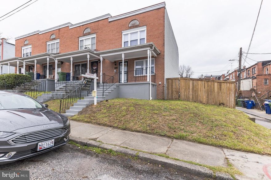 WELCOME HOME. Come check out this darling end of group townhome nestled in North East Baltimore. This home has some great updates, which includes kitchen improvements, Brand new SS appliances, bathroom updates, new wood flooring throughout the main level, and new carpet on the second level. The overly sized back yard, which wraps around one side of the home also includes a 2 car parking pad. What a plus to have. Don't miss out on this charming home.