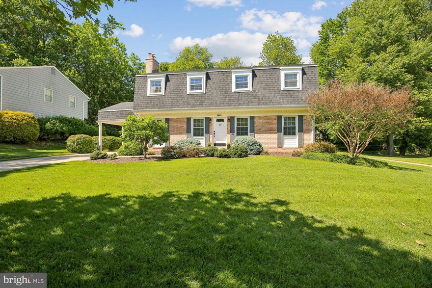 Don't miss this meticulously maintained Colonial situated on a beautifully landscaped lot in the sought-out area of Glenfield Manor. This spacious 4/5-bedroom, 2.5 bath home offers a traditional floor plan with gleaming hardwood flooring, updated kitchen & bathrooms, 1st floor family room with gas fireplace & built-in shelving and a formal dining room.  The private screened-in porch off the dining room, updated kitchen with stainless steel appliances (2024), Primary BR suite with sitting room area (sitting room would be ideal for a nursery), updated primary bathroom with soaking tub & separate shower and carport with access from the kitchen make this home a true find.  Full basement with walkup steps to the screened-in porch (trap door to access porch) gives you an opportunity to expand your living space.  Updated windows, Furnace (2020), Roof-(2017), washer & dryer (2023), Fireplace gas logs (2025). This home is conveniently located to the Glenmont Metro, easy access to commuter routes, shopping, Brookside Gardens and Wheaton Regional Park offer endless opportunities to enjoy nature, trails and outdoor activities. This beautiful move-in ready home is not to be missed!!