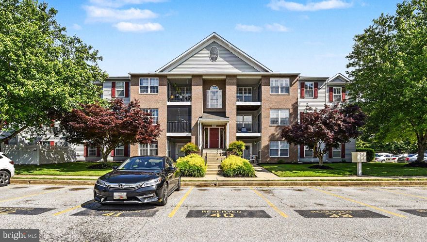 Rarely available, move-in-ready renovated condo in Brandywine Station. This main-floor unit features two bedrooms & one full bath, which includes a safe-step walk-in tub/shower combo. The home boasts wood flooring throughout, w/ tile in the bathroom & laundry rooms. The primary bedroom offers a walk-in closet plus a second, larger closet with a rough-in for a full bath complete w/ an installed fan. The kitchen is updated w/ granite countertops & stainless steel appliances. Key features & recent upgrades include: Accessibility: Along with the safe tub, wide doors & hallway, separate rear entrance w/ a walkway leading directly to the parking lot & a designated handicapped space.  Systems: Newer hot water heater (2024) & heat pump (2018) w/ a transferable maintenance contract. -Security: Located within a building w/ a locked entrance. Pet friendly, you will love the walk-out back patio overlooking a nice private yard & side parking lot. Reserved parking spot in front of building #41.