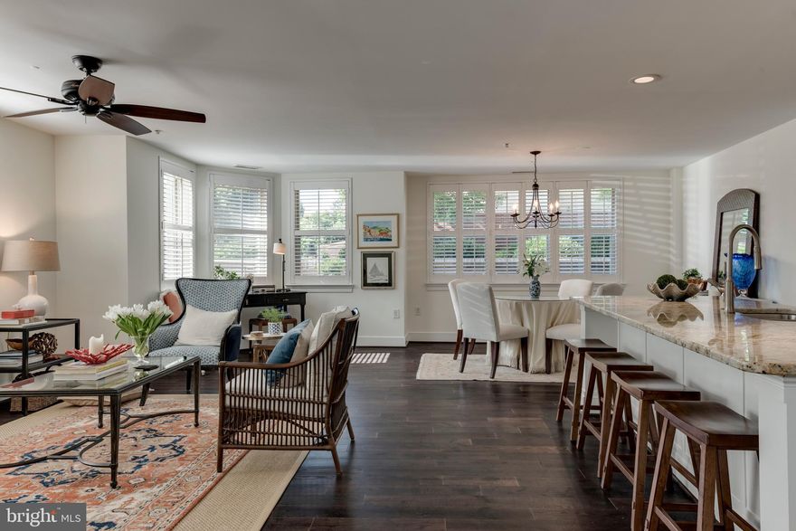 This bright open unit features over $80,000 in upgrades and renovations. Kitchen & Master Bath done in 2016, New Lighting & HVAC 2019, New Front Door, Interior Paint & Wood Floors 2020. Large unit with almost 1,600 sq/ft of living area. Den/2nd bedroom perfect for in home office. Garage Parking right next to your back door perfect for one level living with no steps. Front Door goes right out to South St for walking pets. Acton's Landing features lobby with concierge, fitness center, meeting room, library, party room and waterfront park on Spa Creek steps from your door. Great Location in Downtown Annapolis.