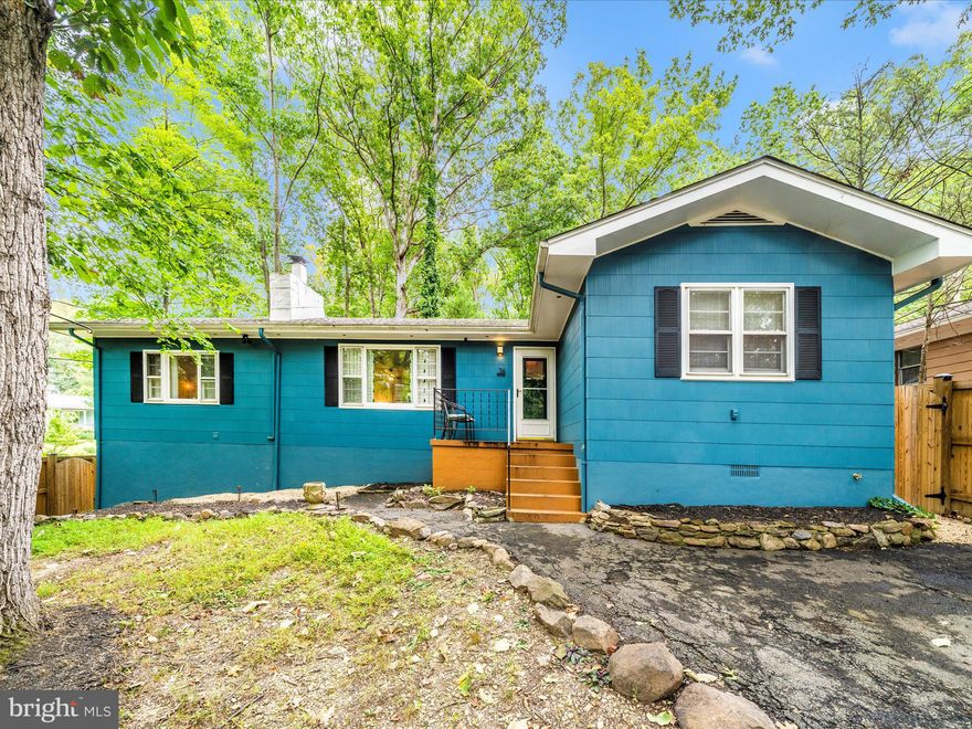 Opportunity knocks!  Whether you seek a profitable investment with a history of high demand for rentals, a forever home, or a soulful getaway, this home has been a sanctuary of joy, privacy, and inspiration.  It carries the gentle marks of time, priced as such and waiting to welcome your own dreams and touches.  The current owner and her teen son have poured their hearts into restoring its charm and relished every lake day.  Now, as they pass the key onto its next chapter, they hope you will fall in love as deeply as they have.
A love story at Shore Lane--a place where every sunrise over the lake is like a promise and every evening is wrapped in mountain tranquility.  Let your heart flourish in this original lake cottage-style home, nestled within a true mountain lake community, just steps from the lake's sandy beach.  Let laughter and memories linger, and the restaurant and bar service provide year-round delights from delicious food, weekend entertainment, to simple lazy evenings lakeside filled with moonlit water.
Cherish mornings walking to the water, afternoons entertaining family and friends with the ease of ample parking in both front and back driveways, and cozy nights curled up by the wood stove as it fills the home with extra warmth and peace.  The open floor plan, bathed in natural light, flows from a spacious foyer entry into two bedrooms-- each a private haven--separated by a recently remodeled bath, where artisanal blue and silver tiles shimmer like the nightly moonlit lake itself.  
Sliding doors open the already expansive living room onto a large deck, and a tree-lined, fenced backyard provides for the watching of seasons changing and limitless shared quiet moements under a canopy of stars.  The kitchen, updated with love--new countertops, sink, and faucet--has been the heart of gatherings and celebrations,  Downstairs, a secluded third bedroom suite features its own full bath and private egress, making it perfect for guests or your own peaceful retreat.  No HOA.  Disclosures available.