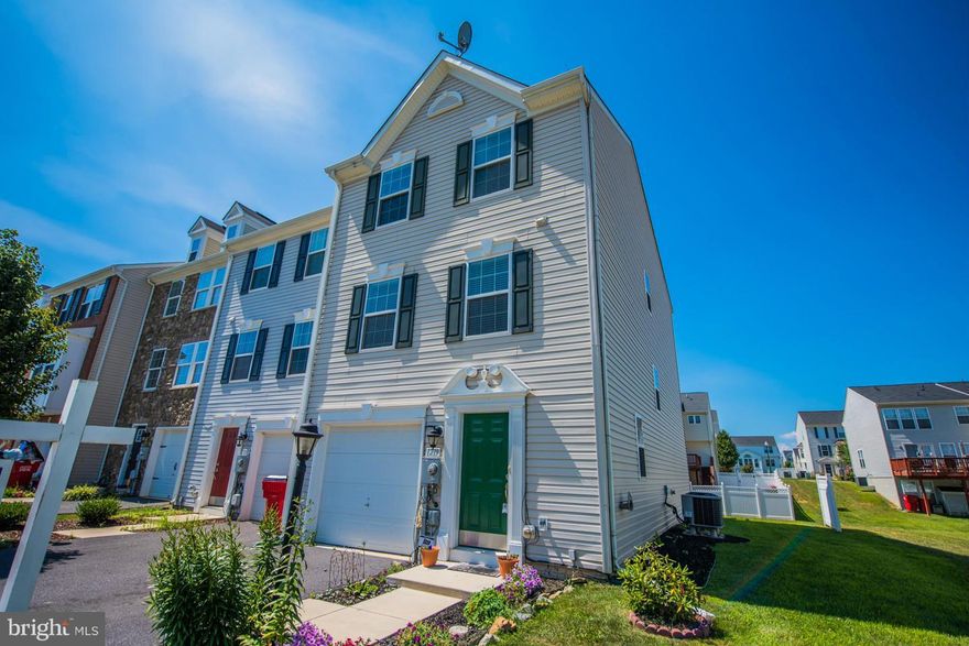 This end unit townhouse is built like a model with 3 level 12ft. bump out featuring 2 master bedrooms; one on the first floor with full bath and 1 on the 3rd level with full bath. Total of 4 bedrooms, 3.5 baths, Sun room, living room, breakfast nook, dining room all with wood floors, family room, laundry, large deck and 1 car garage. A must see!