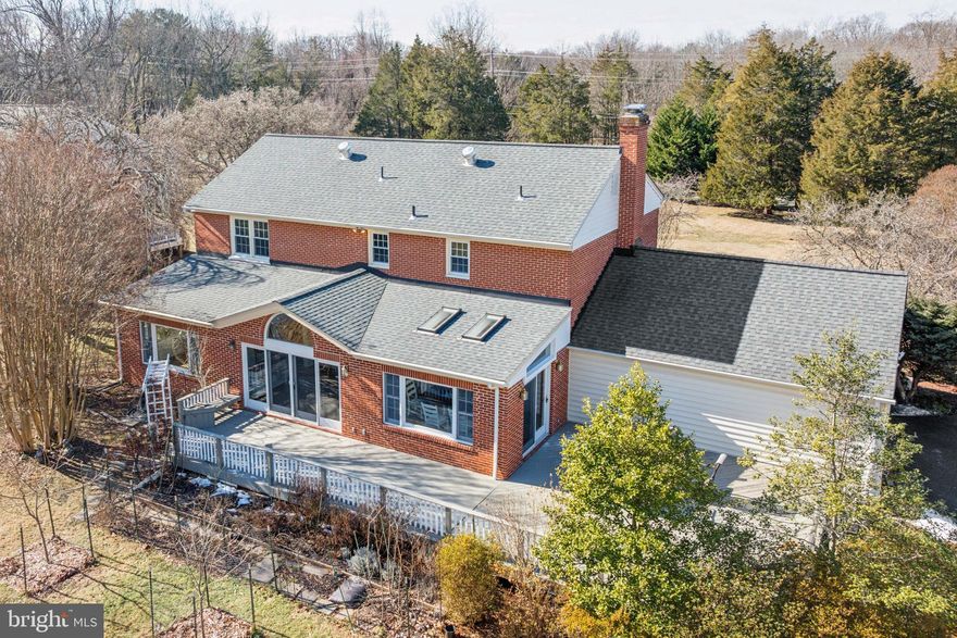 Tucked away on a scenic, tree-lined driveway, this 1+ acre retreat offers unmatched privacy and natural beauty—with no HOA fees! The lush landscape features vibrant flower beds, a vegetable garden, and an array of fruit trees, including peach, apricot, persimmon, Japanese plum, and pomegranate. In the spring, the front yard bursts into color with cherry, magnolia, crepe myrtle, and maple trees in full bloom. The backyard is a true sanctuary, often visited by colorful birds—cardinals, blue jays, goldfinches, and hummingbirds—creating a peaceful, storybook setting.

Inside, this 4-bedroom, 3.5-bath home is bright and inviting, with new flooring, fresh paint, and oversized windows that fill the space with natural light. The sunroom with soaring ceilings and skylights brings the outdoors in, while the spacious living and family rooms—complete with a newly designed bar—make entertaining easy. The gourmet kitchen features granite countertops, stainless steel appliances, an induction cooktop, and double ovens, combining elegance with practicality.

Upstairs, the primary suite is a private retreat with a remodeled bath and custom walk-in closet. Two additional bedrooms share an updated bath, while the fourth bedroom has its own en suite, ideal for guests or an au pair.

The fully finished basement offers endless possibilities—whether you envision a home gym, theater, game room, or additional living space. Recent updates enhance the home’s comfort and style, including a new water heater, fresh interior paint throughout, updated outlets and doors, and new flooring throughout the entire home.

Located in a top-rated school district, this home blends modern updates, privacy, and natural beauty in one of Potomac’s most desirable locations. Schedule your private tour today!
