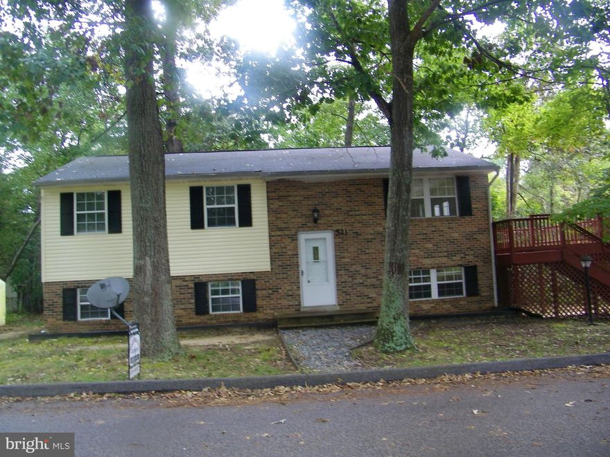 This property has a fully finished Lower level - with LEVEL walk way from a 2nd, separate driveway. (yes, 2 driveways) Could easily accommodate a wheelchair for handicap needs, or could be an apartment for Mom and Pop or grown children.  Lower level Bath very large.  In addition to the 5 Bedrooms and Full finished Rec room, there is an additional room in lower level perfect for office.  Ex-Lg Deck