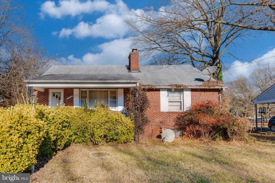 Embrace the character of this all brick, 2-story rambler, awaiting your vision and personal touch. Featuring 4 bedrooms and 1.5 bathrooms with over 1,600sf of living space, this home offers a great canvas. Discover its original charm with hardwood floors throughout the main level, along with a spacious kitchen and living room with fireplace, radiating warmth and potential throughout. The main level also consists of two bedrooms and one full bath. The basement includes two additional bedrooms accompanied by a half bath. Attic has room for storage. Outside features include a front porch, an oversized 2-car garage, and large spacious yard. This is your opportunity to infuse new life into this older gem. Schedule your showing today! Home is being sold “AS-IS.”
