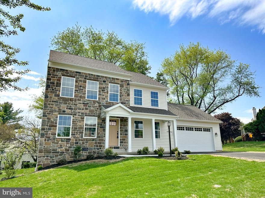 ASK ABOUT OUR $10,000 BUYER CREDIT!  Brand New Home in an Established, Tree-Lined Neighborhood. Don’t miss this rare opportunity to own a brand new home in one of the area's beautiful, mature, and walkable neighborhoods! Nestled among tall trees and surrounded by well-established homes, this stunning 2-story traditional home offers the perfect blend of timeless charm and modern convenience. Featuring a classic stone and vinyl exterior, this thoughtfully designed 4-bedroom, 2.5-bathroom home boasts quality craftsmanship and tasteful finishes throughout. The main level is adorned with durable solid surface flooring, 8-foot ceilings, and an upgraded millwork package that adds elegance to every room. The heart of the home is the spacious kitchen, featuring a custom-built island, quartz countertops, and direct access to the rear composite deck—perfect for entertaining. The living room is anchored by a beautiful built-in electric fireplace with stone surround, while the adjacent office/den includes custom built-in cabinetry for a functional yet stylish workspace. Custom-built mudroom bench and oversized 2-car front-entry garage offer daily convenience. Upstairs, you'll find four generously sized bedrooms, including a serene primary suite, and another full shared bathroom. Additional highlights include high-efficiency electric heat pump for heating and central air, full basement with sump pump and passive radon mitigation system, granite countertops in all bathrooms. Homes like this never become available in this highly desirable neighborhood—especially brand new construction.