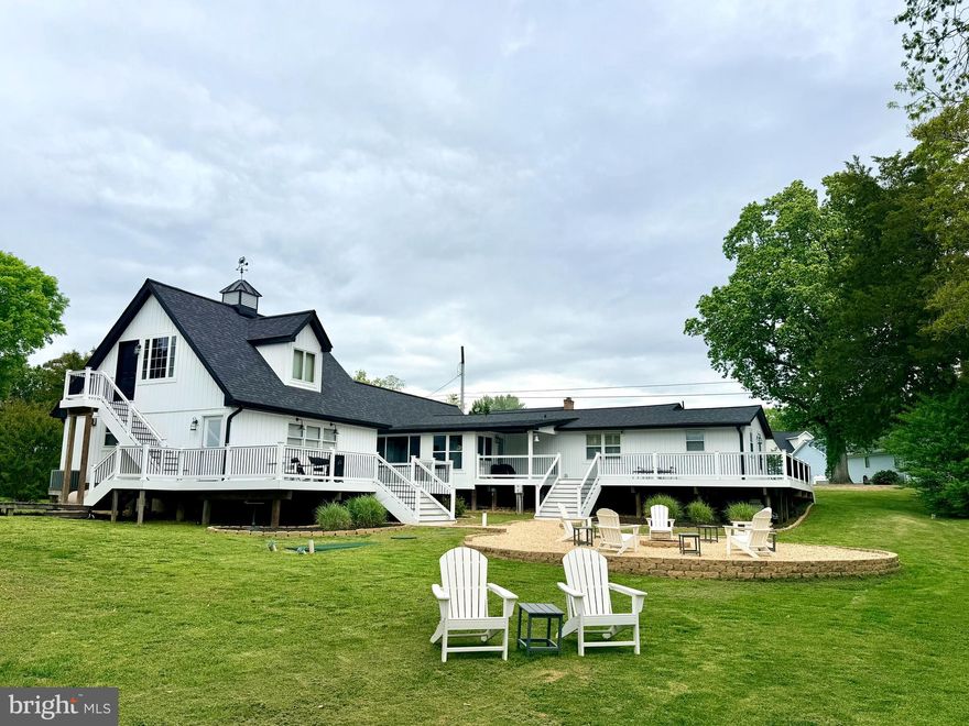 Seriously, what's not to love! The quiet setting with double decks are perfect for morning coffee, relaxing at the end of the day or entertaining as everyone will love the views of the water and the spacious backyard with built in fire pit. Inside, there is plenty of room for everyone! The garage has been converted to a large and open common space as it is temperature controlled. Enjoy movie nights, working out, playing games or whatever fits your life! There are 4 nice sized bedrooms, updated kitchen with a breakfast nook to enjoy views of the water. The updated kitchen makes it much easier to prepare your best recipes or gather with loved ones. The current seller has repainted and updated all the big items - septic, roof, siding and decking so you can just move in and relax! Conveniently located to Patuxent Naval Base, Dominion Cove, Solomons and so much more!