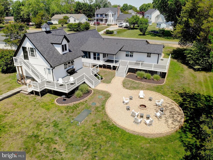 Seriously, what's not to love! The quiet setting with double decks are perfect for morning coffee, relaxing at the end of the day or entertaining as everyone will love the views of the water and the spacious backyard with built in fire pit. Inside, there is plenty of room for everyone! The garage has been converted to a large and open common space as it is temperature controlled. Enjoy movie nights, working out, playing games or whatever fits your life! There are 4 nice sized bedrooms, updated kitchen with a breakfast nook to enjoy views of the water. The updated kitchen makes it much easier to prepare your best recipes or gather with loved ones. The current seller has repainted and updated all the big items - septic, roof, siding and decking so you can just move in and relax! Conveniently located to Patuxent Naval Base, Dominion Cove, Solomons and so much more!