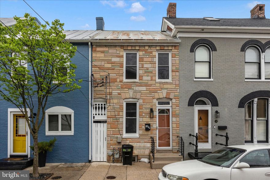 If you're searching for charm and character in the heart of downtown Frederick, look no further. This delightful row home features exposed brick walls, an updated kitchen, and four spacious levels of living.   There is plenty of storage space in the lower level, so you can ditch your expensive storage unit!  Enjoy outdoor living with a private covered deck, patio, fenced yard, and the convenience of two rear parking spaces.  Step outside and take in everything downtown Frederick has to offer year-round—from vibrant restaurants and cozy cafés to unique shops and local entertainment—all just a short stroll away. Commuters will appreciate the easy access to public transportation and the MARC train.  This is downtown living at its finest—schedule your showing before it's gone!  Sold as-is.  Inspections for informational purposes only.