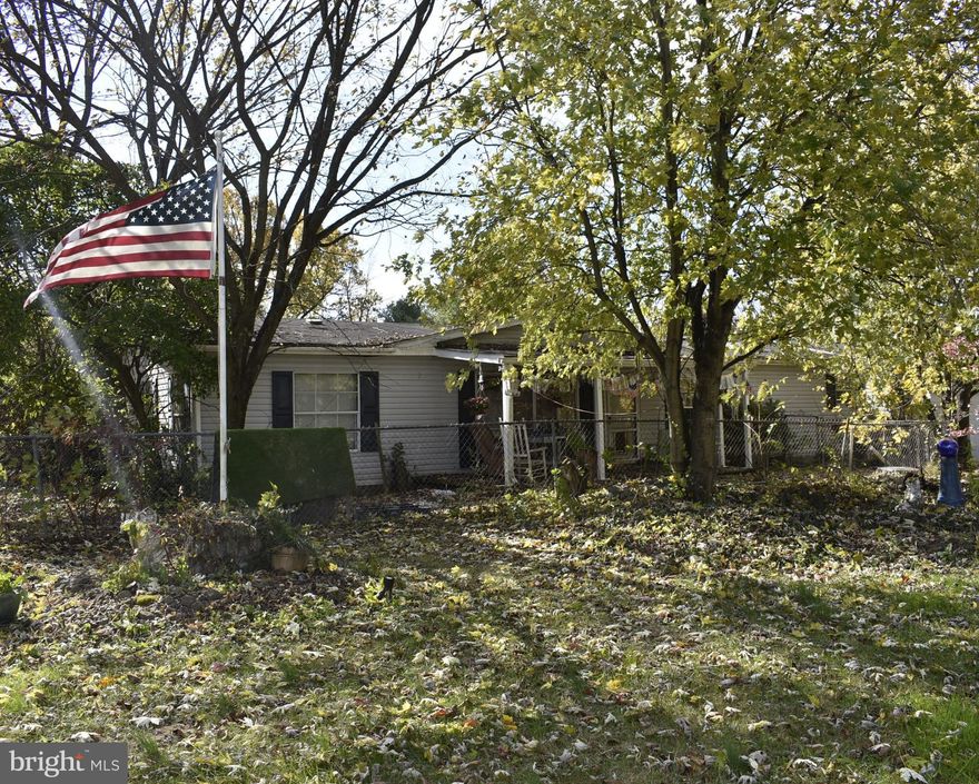 PRICE REDUCTION. PRICE IS FIRM AT $135,000. Home needs cosmetic renovations and repairs. Being sold AS - IS. Want to get away from all the hustle & bustle. A place to escape on weekends or as a permanent residence. 3 bedrooms and 2 full baths situated 1.441 Ares +-. Set on your front porch and watch the wildlife. Built in 1990, the property boasts a traditional floor plan that invites you to create lasting memories. There's ample room for relaxation and personal space. The heart of the home features a kitchen with essential appliances, making meal preparation a delight. The cozy living spaces provide a warm atmosphere for gatherings overlooking the rear yard. The property features a fenced in area for the family dog to roam. The property also offers features a two-car detached garage right off the kitchen. Located in a rural setting, this home is just a short drive from local parks, schools, and community amenities, ensuring a balanced lifestyle. The neighborhood is known for its friendly atmosphere and access to nature, making it ideal for outdoor enthusiasts. A short drive to Hancock MD with the paved Western Maryland Bike Path, C&O Canal & Potomac River.  Experience the charm of Berkeley Springs, where community spirit thrives and every day feels like a retreat. If you work in the city but crave the countryside, this location is a perfect fit - just an hour and a half from Washington DC & Baltimore making the property ideal for getting away on weekends and just relaxing. The property is being sold AS-IS, but the possibilities here are endless. This property is not just a house; it's a place to call home. All the personal items at the house on the day of settlement convey with the house.