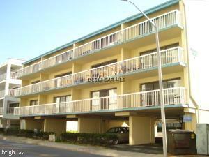 A RARE find, 2 story condo with over 1300 square feet of living space. Convenient mid-town location on ocean block. This large, top floor condo offers a large open floor plan, 3 bedrooms, 2 baths & washer and dryer within the unit. The second floor bedroom offers a private bathroom, walk-in closet and a large private terrace offering a place to relax, sunbathe or watch the sunset. 2 more balconies on the main floor offer bay or ocean views. The condominium is of masonry construction and offers off-street parking with 2 assigned parking spots and (2) shared community storage lockers on the ground floor. Not currently a rental however, the large square footage and plenty of sleeping capacity would make this a great investment! Priced to sell quickly, you won't want to miss this one!