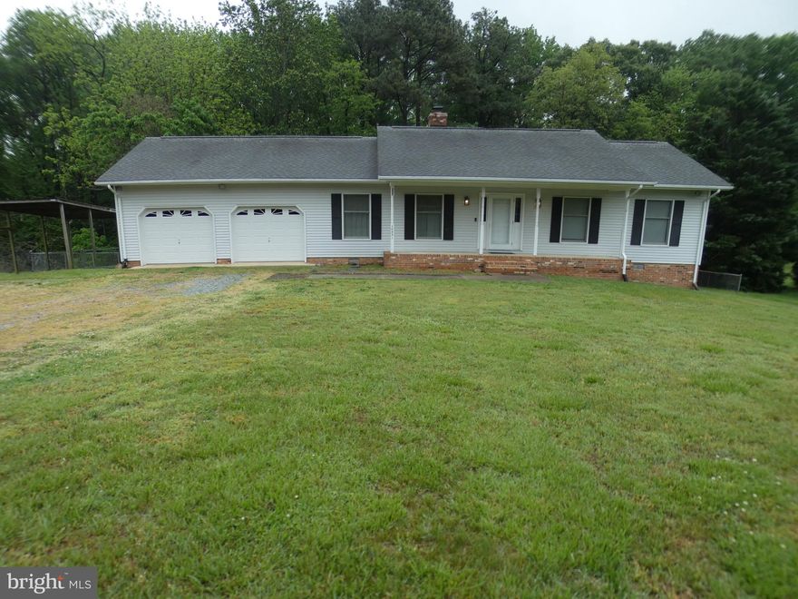 Welcome to this stunning home nestled on over an acre of land!  Relish in the spacious family room with its cathedral ceiling, surrounded by an expansive deck and a fenced backyard, perfect for entertaining guests.  This charming home features a welcoming front porch, a cozy country kitchen, a separate mudroom with a convenient washer/dryer setup.  Enjoy the tranquility of the property, which offers a level lot backing onto trees.  Complete with a large driveway and a 2-car garage, this home has it all!