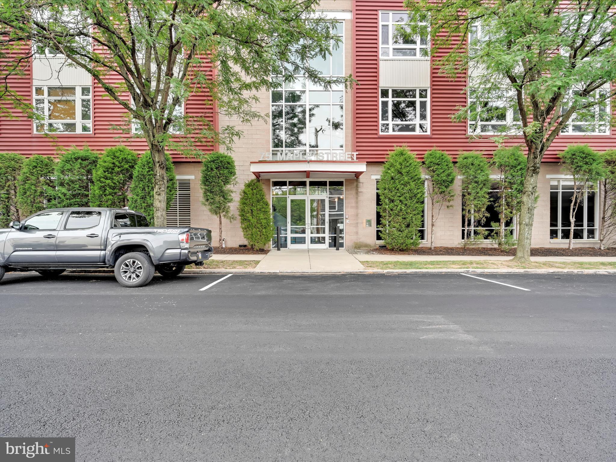 Welcome Home to the Distinctive Maple Street Condominium in the heart of Conshy! Spacious 2 bed, 2 bath condo in the highly desirable Industry Condominiums, perfectly blending modern style with industrial charm. The open floor plan features exposed beams, ductwork, maple hardwood floors, and a cozy fireplace—ideal for relaxing or entertaining guests. Floor to ceiling windows allows for light to poru inside. The kitchen offers stainless steel appliances, flat cooktop and plenty of space to prepare and serve meals. The primary suite includes a walk-in closet and full bath, while the second bedroom and bath provide comfort and privacy for guests. Fully accessible first-floor location. Enjoy an unbeatable location in the heart of Conshohocken—just steps to restaurants, cafes, shops, and biking/walking trails, with regional rail a few blocks away for an easy commute to Center City or King of Prussia. Quick access to I-76 and I-476 makes travel in any direction a breeze. Close the door, walk away and enjoy care free living. One Year Shield PLus Home Warranty for Buyer peace of mind.