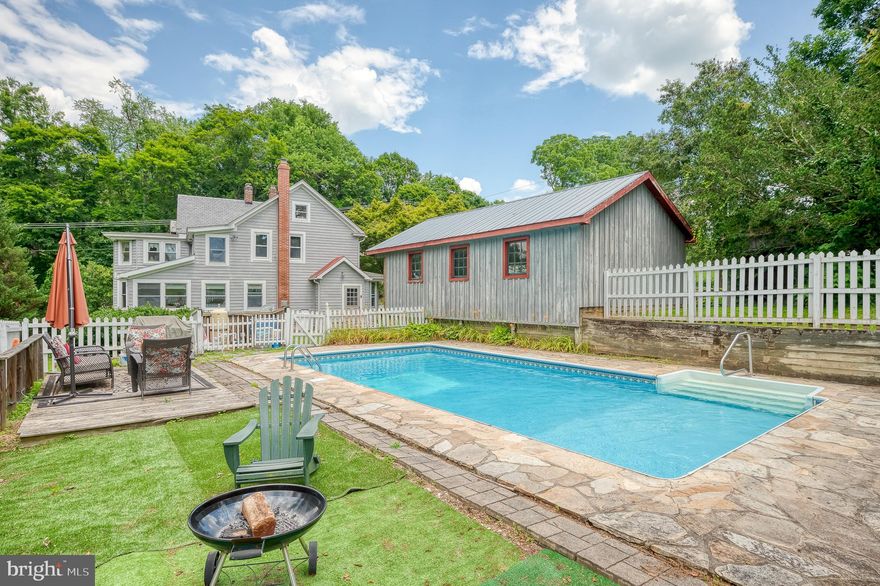 This home sits in the heart of Monkton and offers a home rich in history and outdoor adventure along the Gunpowder River, arguably one of the best fly-fishing rivers in the country.  Wake up early as the sun is rising and have a run on the NCR trail, sip coffee on your front porch and watch the world go by, grab a tube and head to the Gunpowder River, or take a dip in your backyard pool.  This Monkton Village 4 bedroom, 3 full bath home in the Hereford Zone is anything but a cookie cutter boring Colonial.  Your share your own private access with your neighbors to the trail where you can bike, run, ride a horse, walk, tube or fish the 20+ miles of path from Ashland Rd in Cockeysville and extending North of the Mason Dixon line into Southern PA. This historic porch front beauty offers all the charm of yesterday with exposed beams, original pine floors, gorgeous trim, doors and window casings, claw foot tub, and meandering stone walls and bluestone walkways remind us of a slower and quieter time when you could hear the train moving people from the city to the countryside. The best part is the home has been meticulously maintained and updated through the years including plumbing and electric. The traditional center hall colonial is not what you would expect for the age of this home with tiny closed off rooms, this home offers an incredible floor plan on the main level with a blend of open concept and defined spaces in rooms where the light soars in.  There is a first floor full bath, which gives you the option of having a first floor bedroom if needed.  The upstairs primary bedroom is a serene retreat with two large closets and a bonus sitting room. The other three bedrooms share a hall bath with a claw foot tub. There is an additional attic/loft space that offers ample storage or a bonus gaming/playroom. The convenient mudroom coming from the 3 bay carport is the place to kick off your boots and hang your coat.  The outdoor space is gorgeous with an inground pool and two lots that total over 1.69 acres with mature trees and wide open field/play space.  This Monkton home is everything you could ever want in Blue Ribbon Hereford Zone Schools which are all less then 5 miles away.  Be sure to plan your visit and check out the local brewery, cafe, or take a yoga class at the Manor Mill where you will find a local art studio offering classes and events daily. Afterall this is My Lady's Manor one of the most scenic and desired neighborhoods of all of Baltimore County.