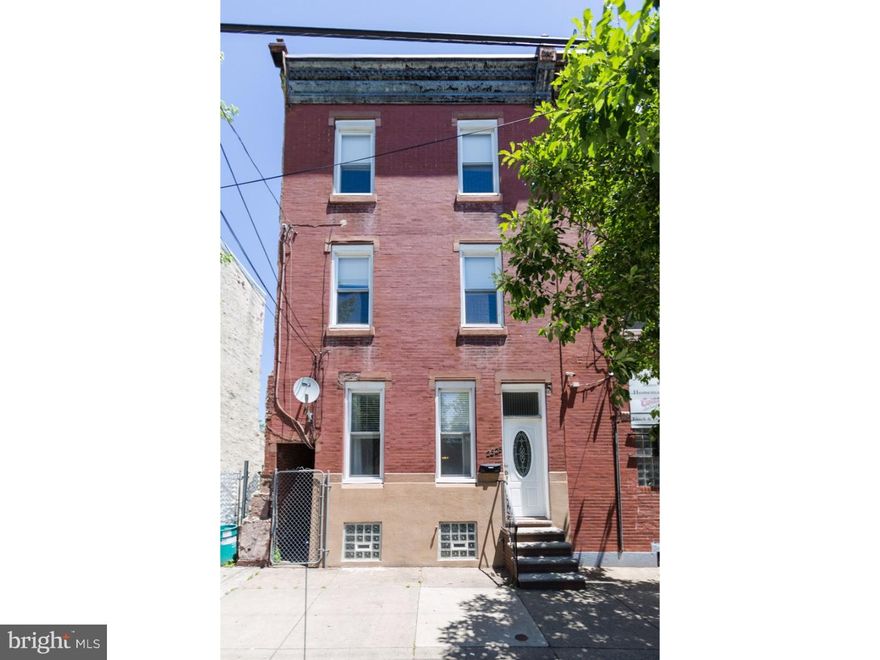 Soaring brick front home, 2,500 sf of space, 4 enormous bedrooms, 2 full baths, 2 decks and a yard, and all of this in a great location in Fishtown. This home features recessed lighting, a large open 1st floor with a huge living room, equally sizable dining room and an eat in kitchen. Beautiful inlaid hardwood floors throughout. The kitchen is filled with natural light and includes a stainless appliance package, polished granite counters and solid wood cabinetry with wine rack. There is a covered walk out deck accessible from the kitchen and a large rear cement yard. Massive, full, tall unfinished basement is used for storage but imagine the other uses! The 2nd floor has the laundry room, 2 big bedrooms and a full hall bath. The rear bedroom has a private walk out deck. Original decorative stair case and hand rails lead from the 1st floor all the way up to the 3rd floor where there is a master suite with private full bath, large closet in the bath and a 4th bedroom. Tall ceilings, central air, multiple outdoor spaces, plenty of rooms for everything your hear and imagination desires such as office, guest space, studio, and so many options with the large basement space.